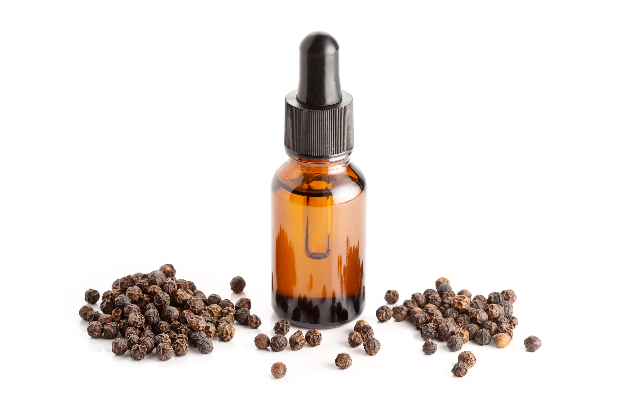 Black pepper essential oil isolated on white background