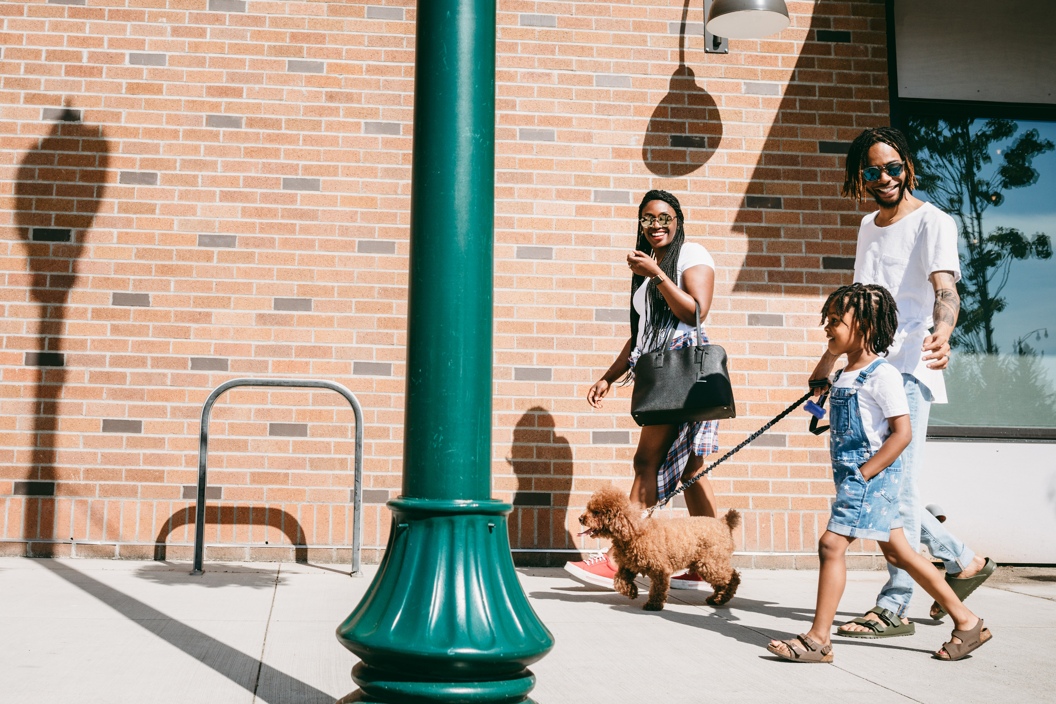 Family Walking Dog In City of Tacoma