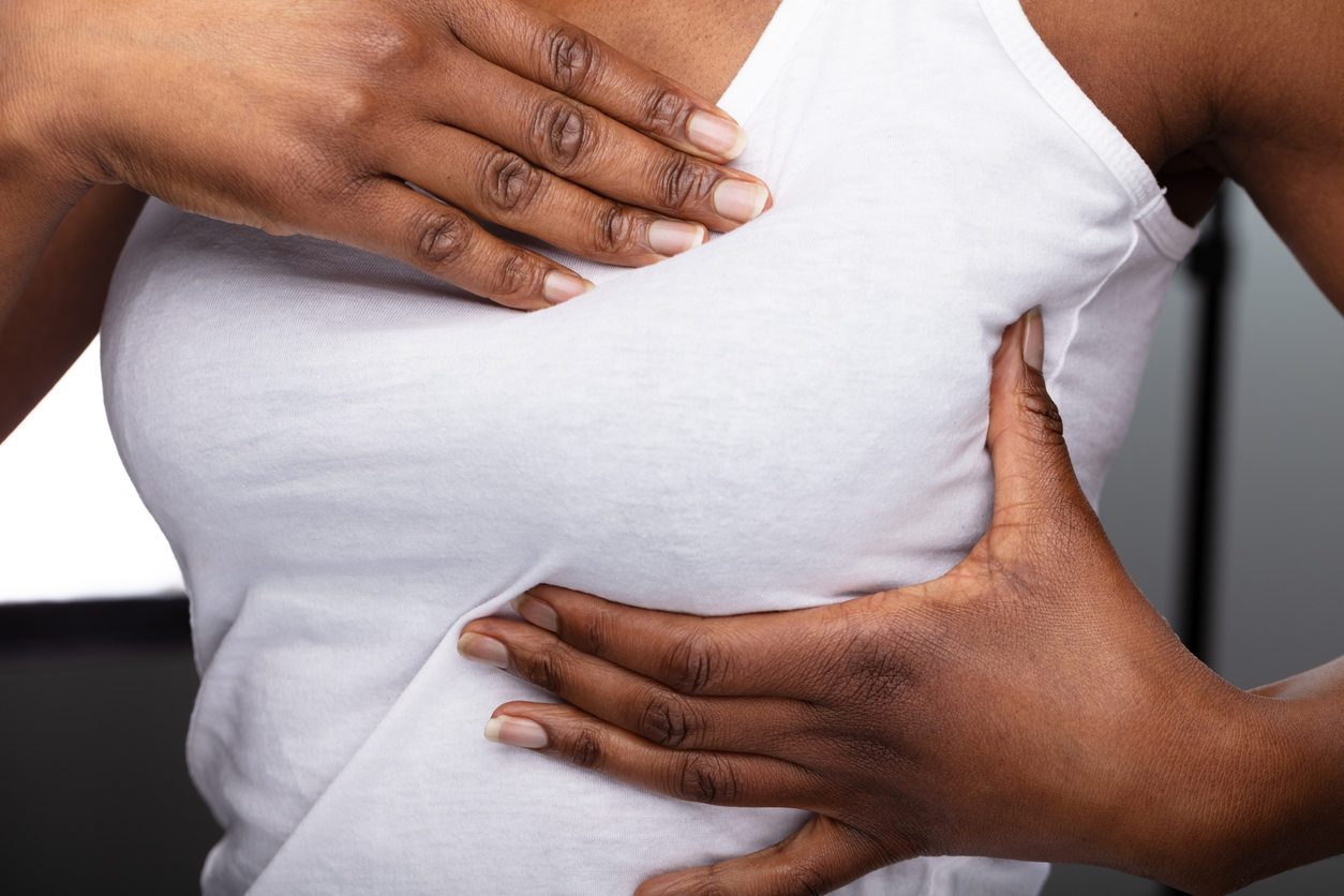 Close-up Of A Woman's Hand On Breast