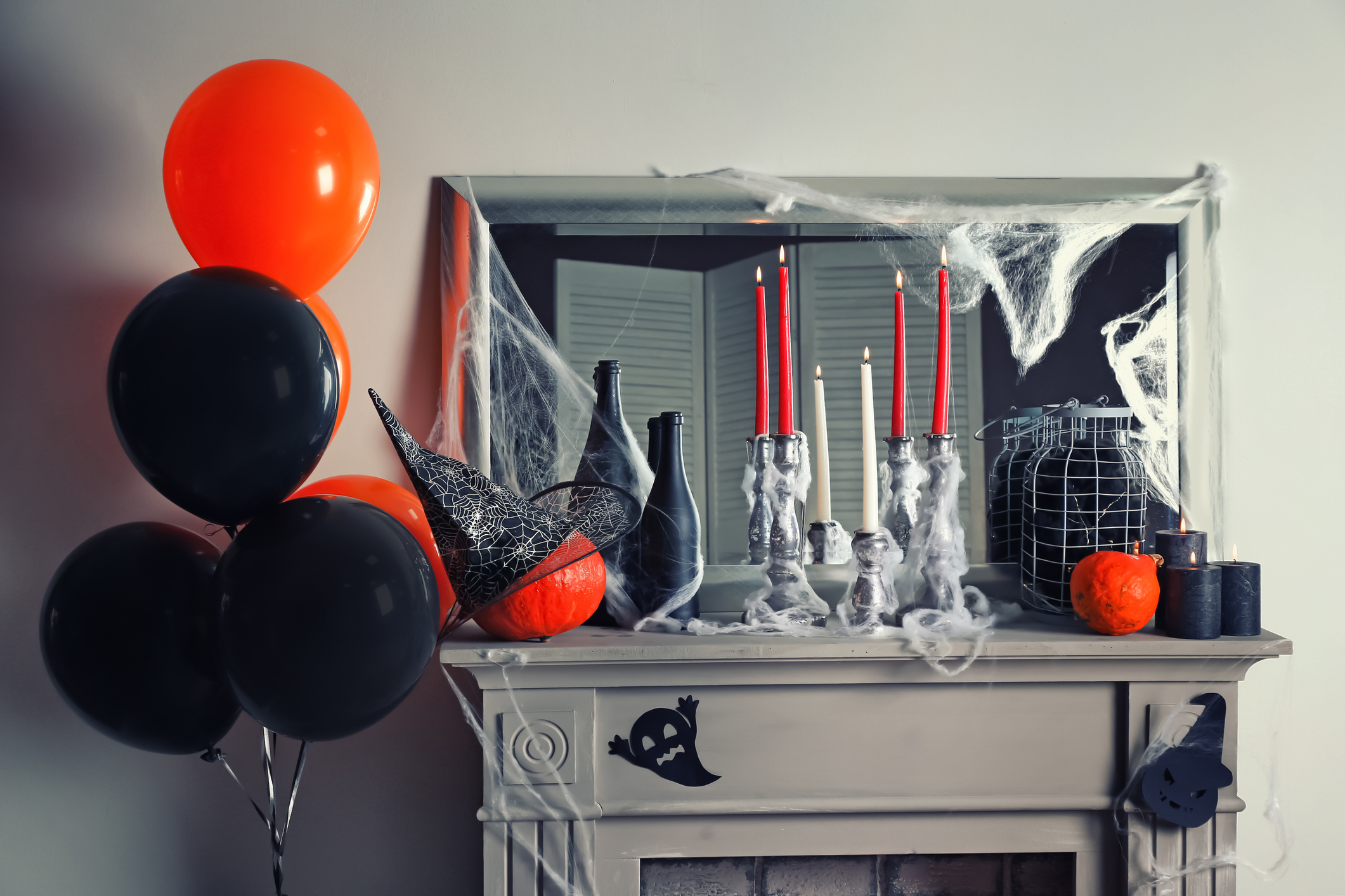 Creative decorations for Halloween party on mantelpiece