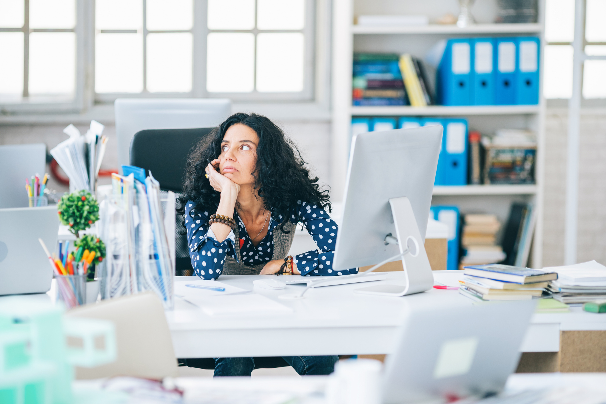 Mid adult interior designer having problem at office