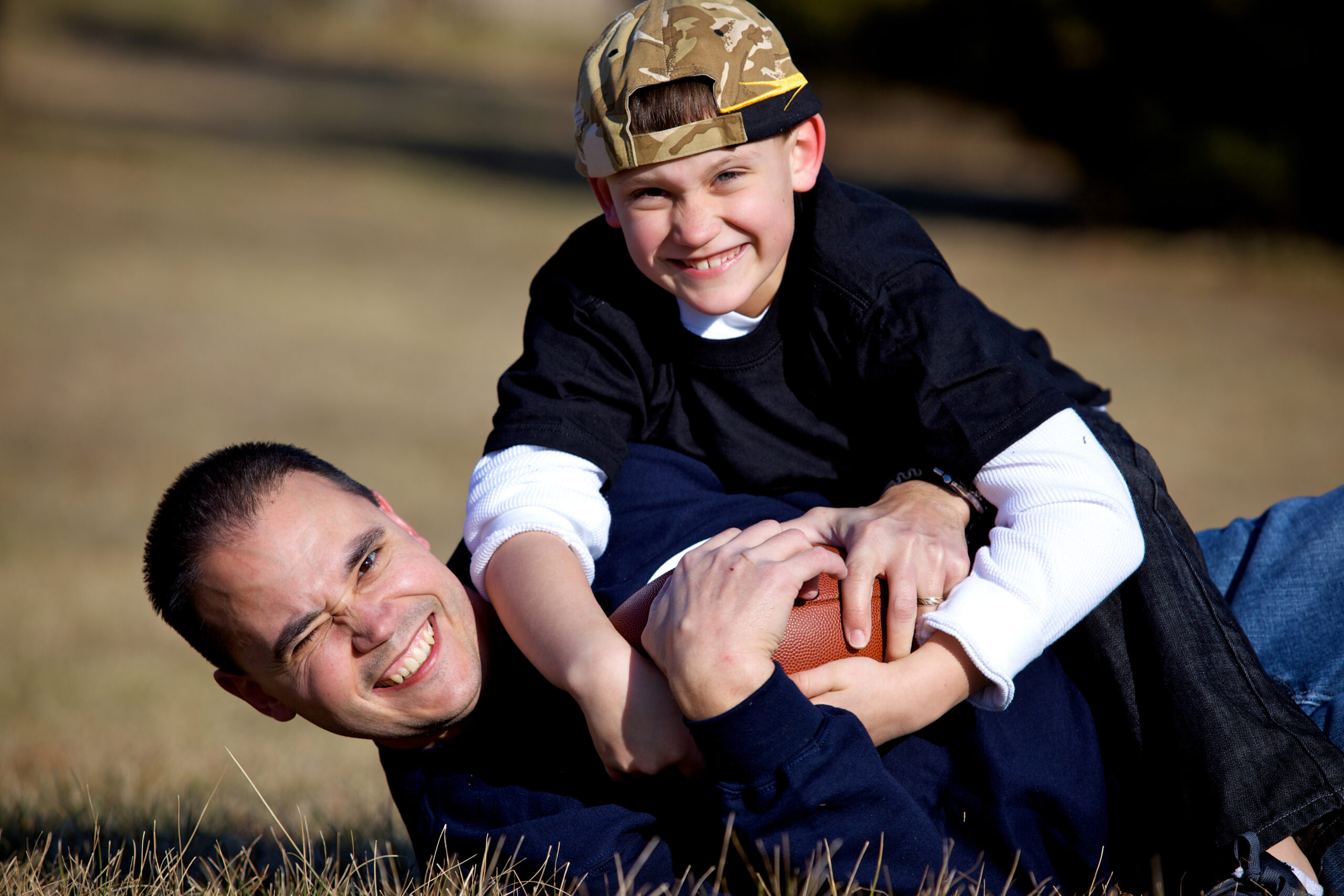 father son outdoor football