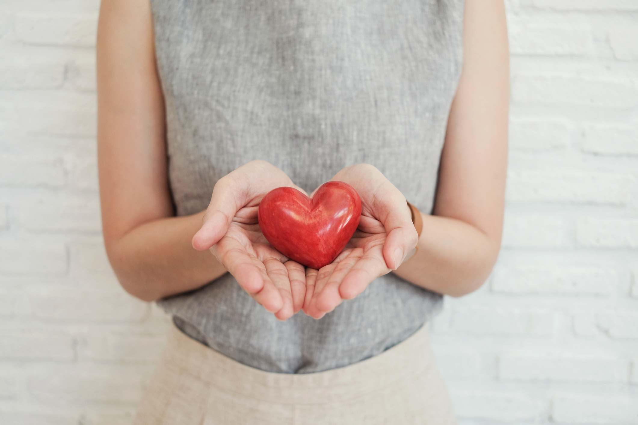 woman holding red heart, health insurance, donation charity concept