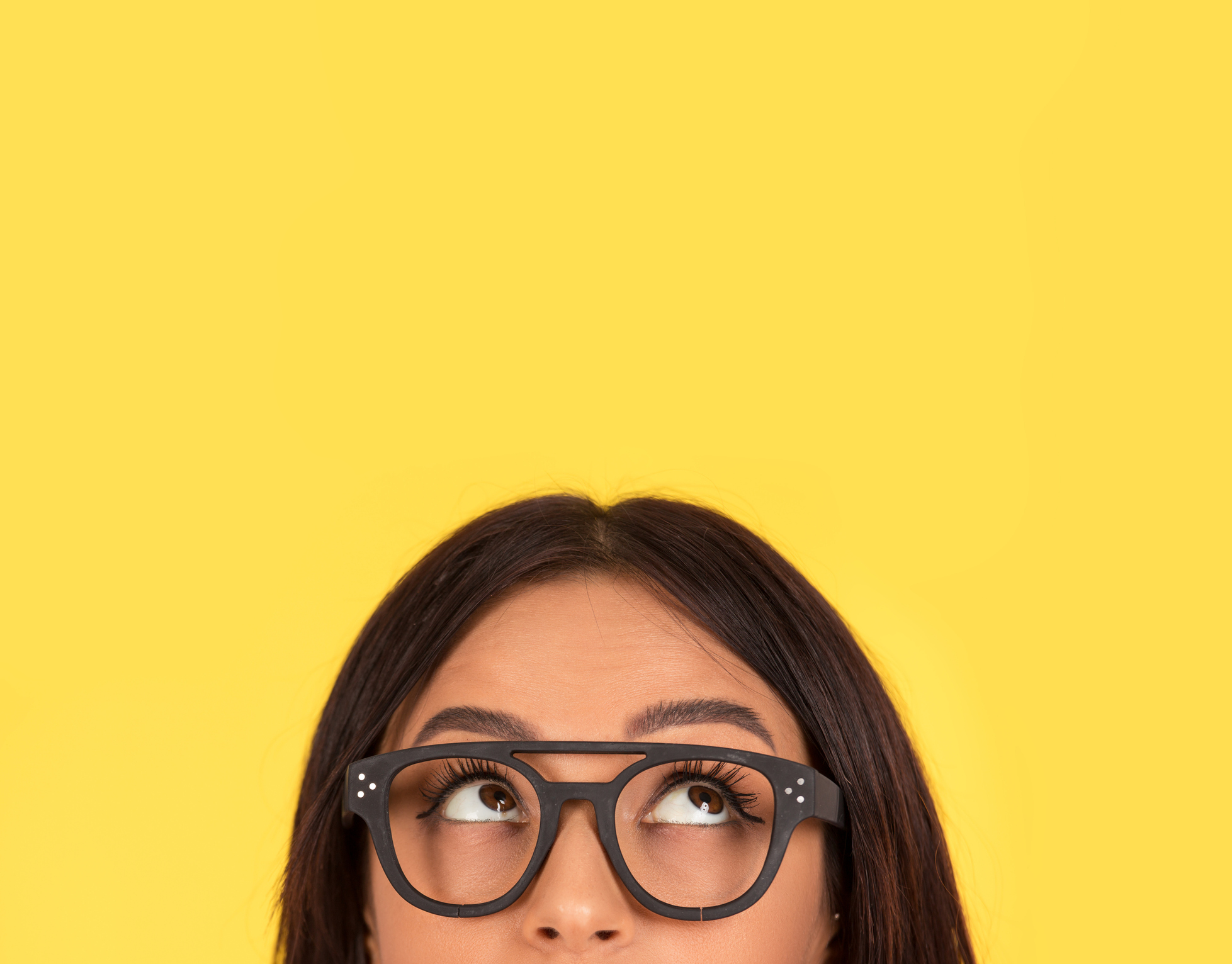 closeup portrait headshot cute happy woman in glasses looking up