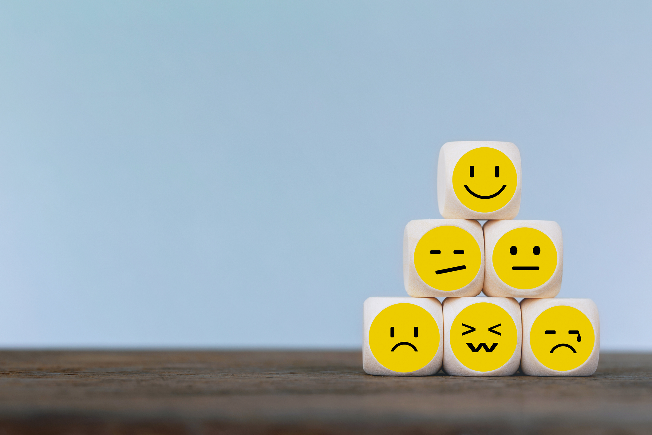 Emoticon icons face on Wooden Cube , Costumer service concept