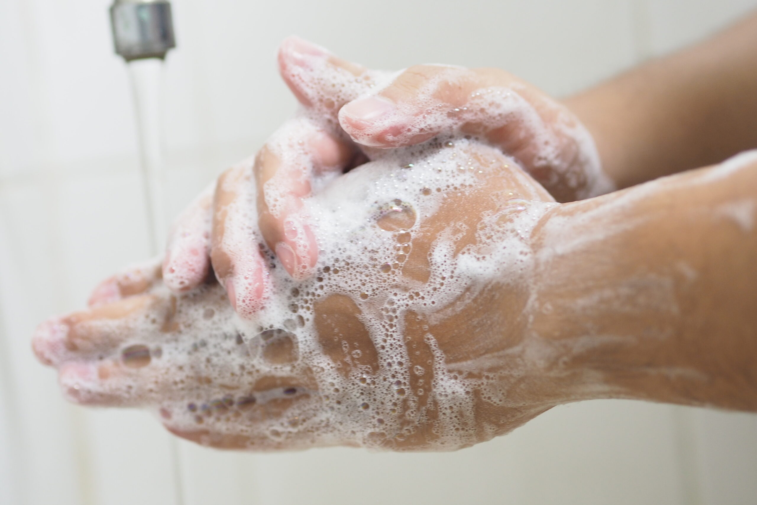 Close Up Of Medical Staff Washing Hands. Hand hygiene.