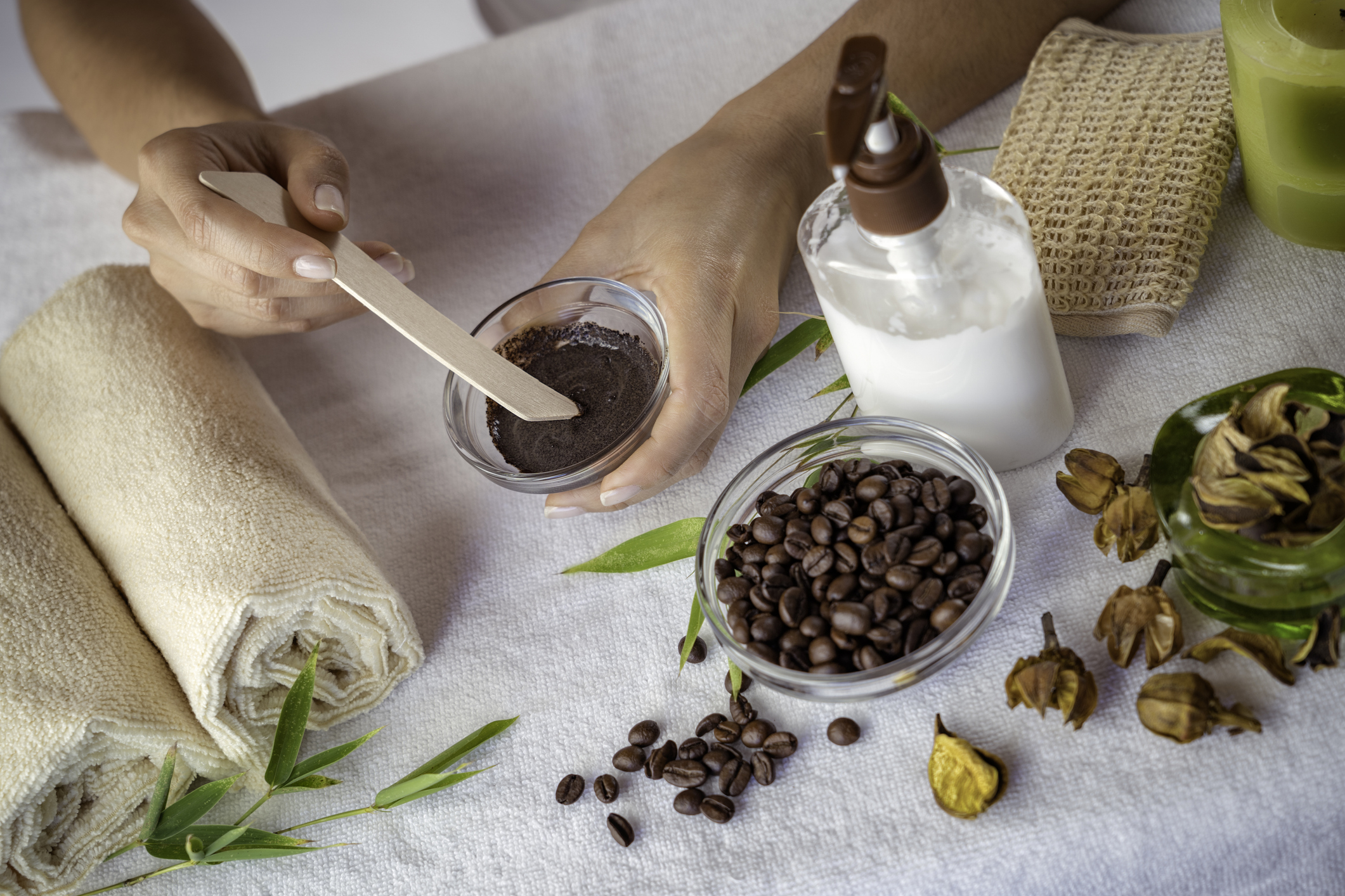 Young woman making coffee facial mask for skin scrub treatment