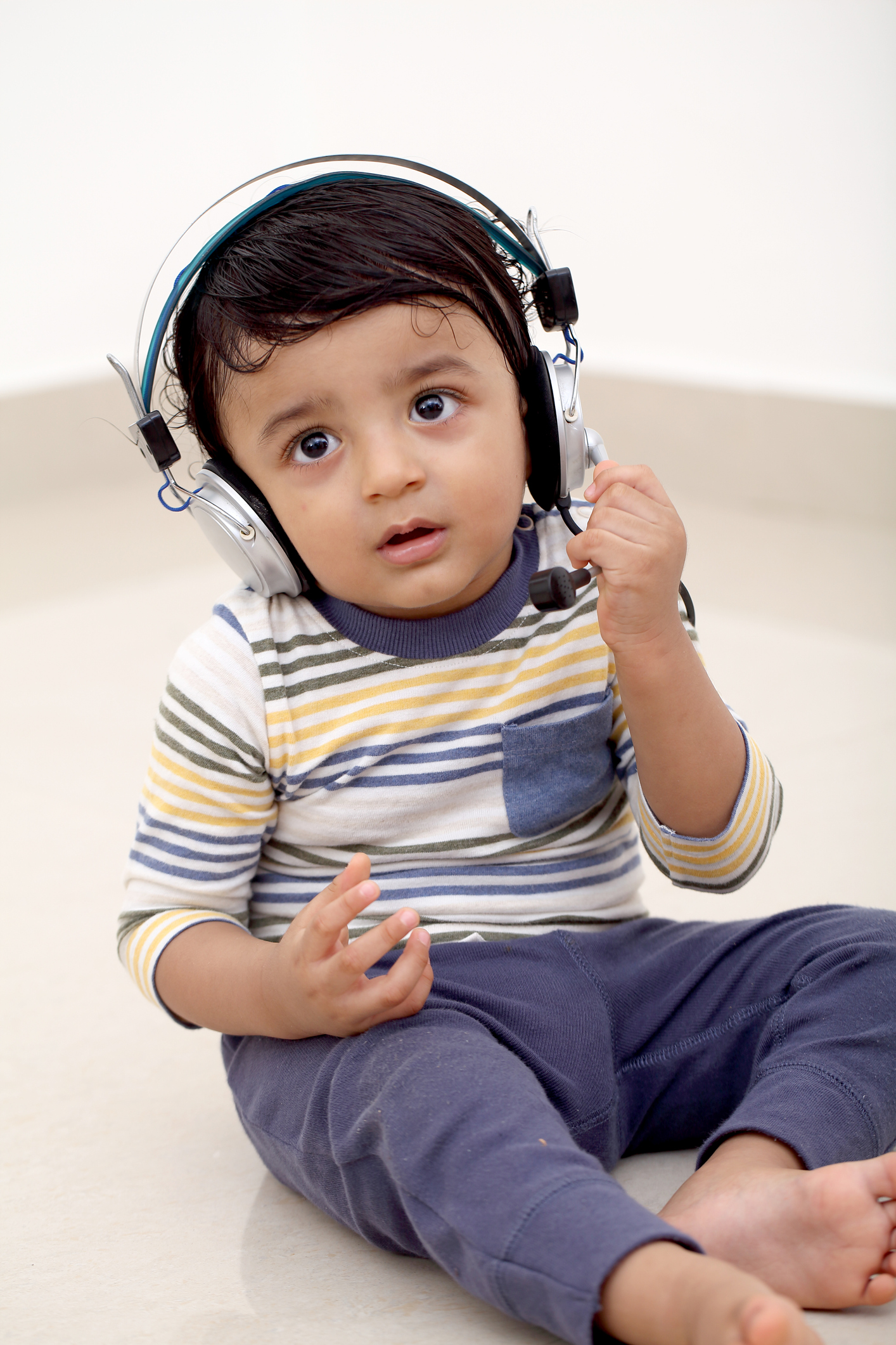 Adorable toddler wearing headset