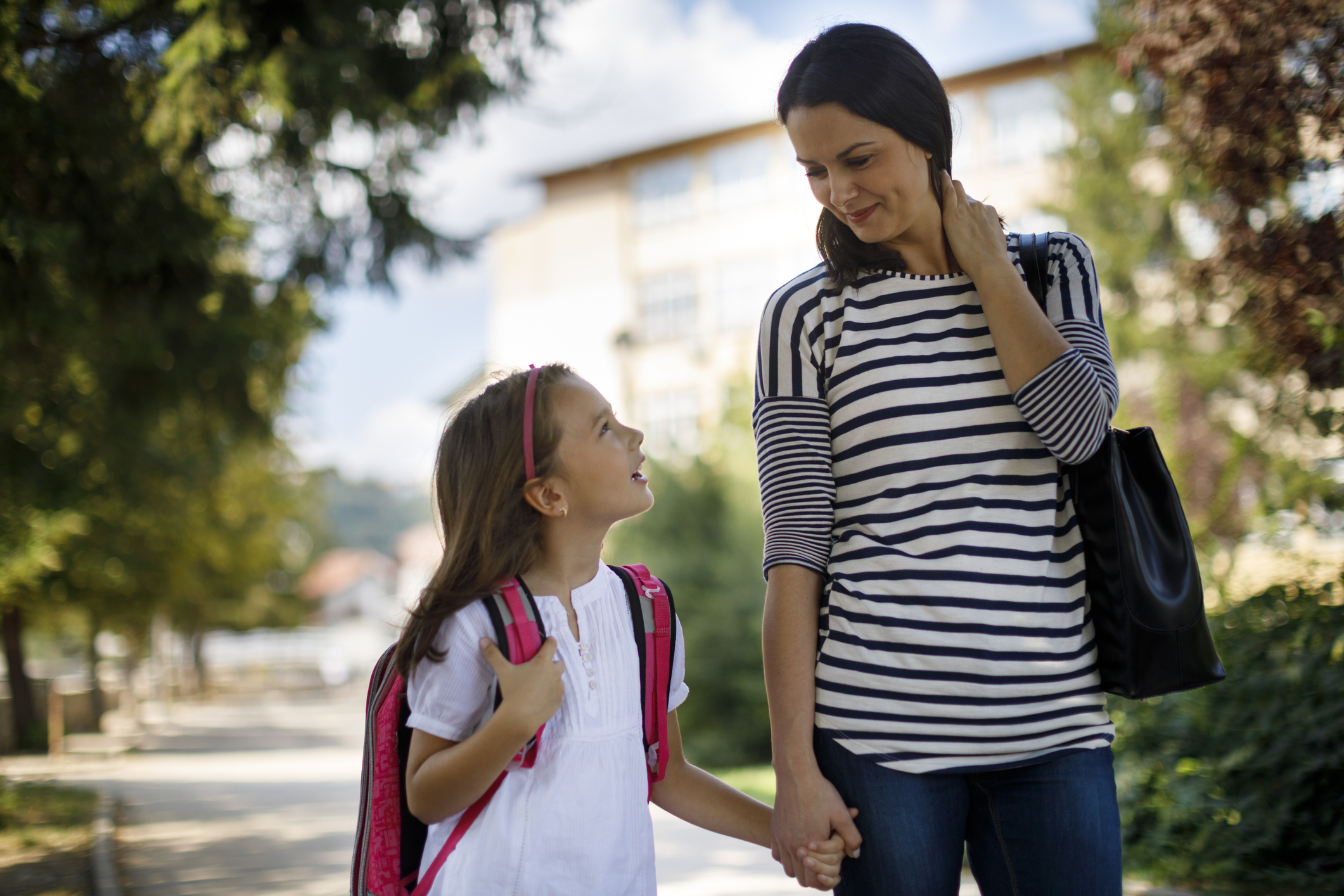 Mother and child going home from school