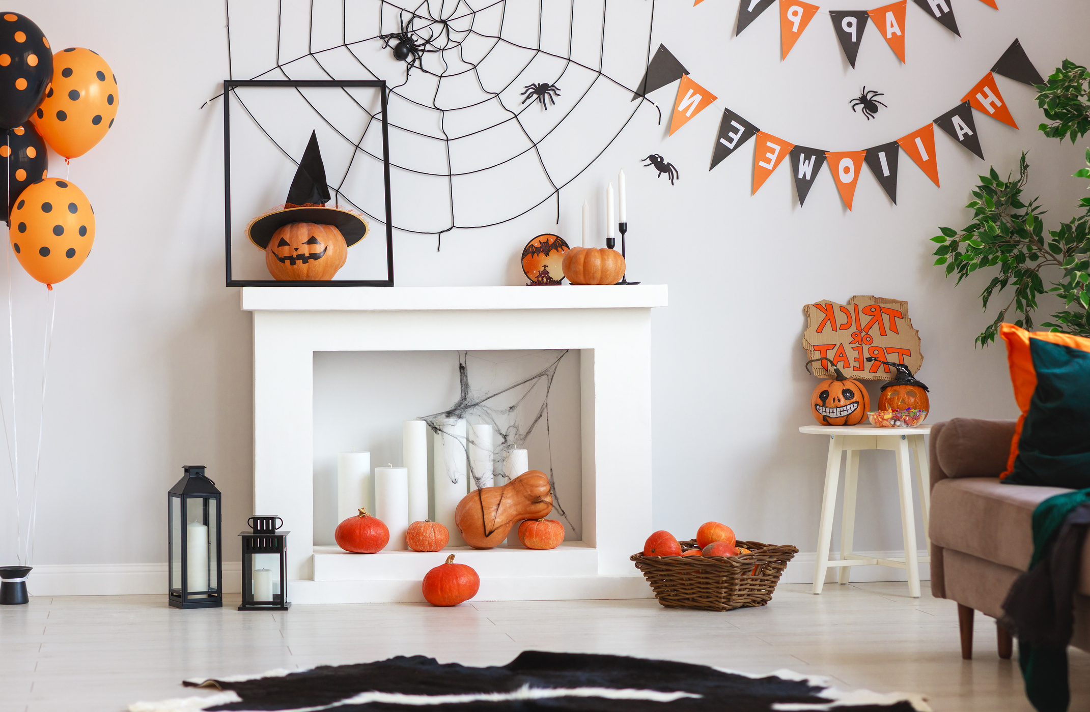 interior of house decorated for Halloween pumpkins, webs and spiders