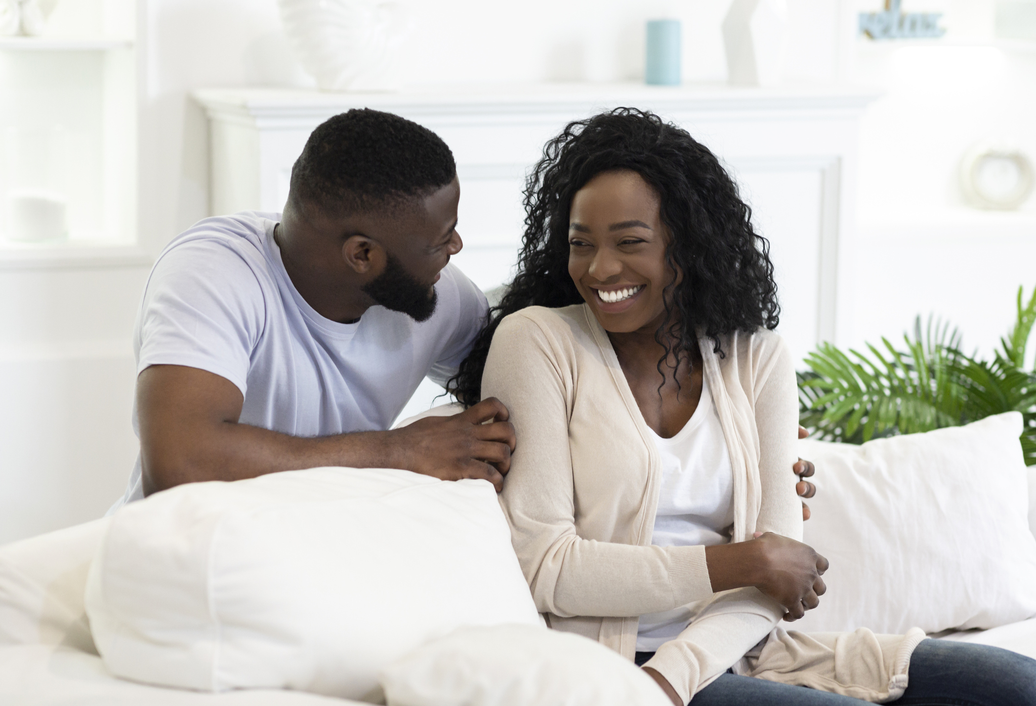 Cheerful african american couple having fun at home