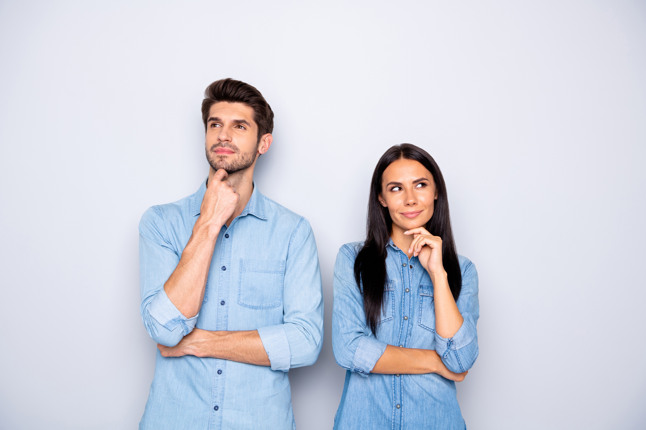 Portrait of his he her she nice-looking attractive lovely charming cheerful bewildered suspicious couple partners wearing casual creating idea isolated over light white pastel color background