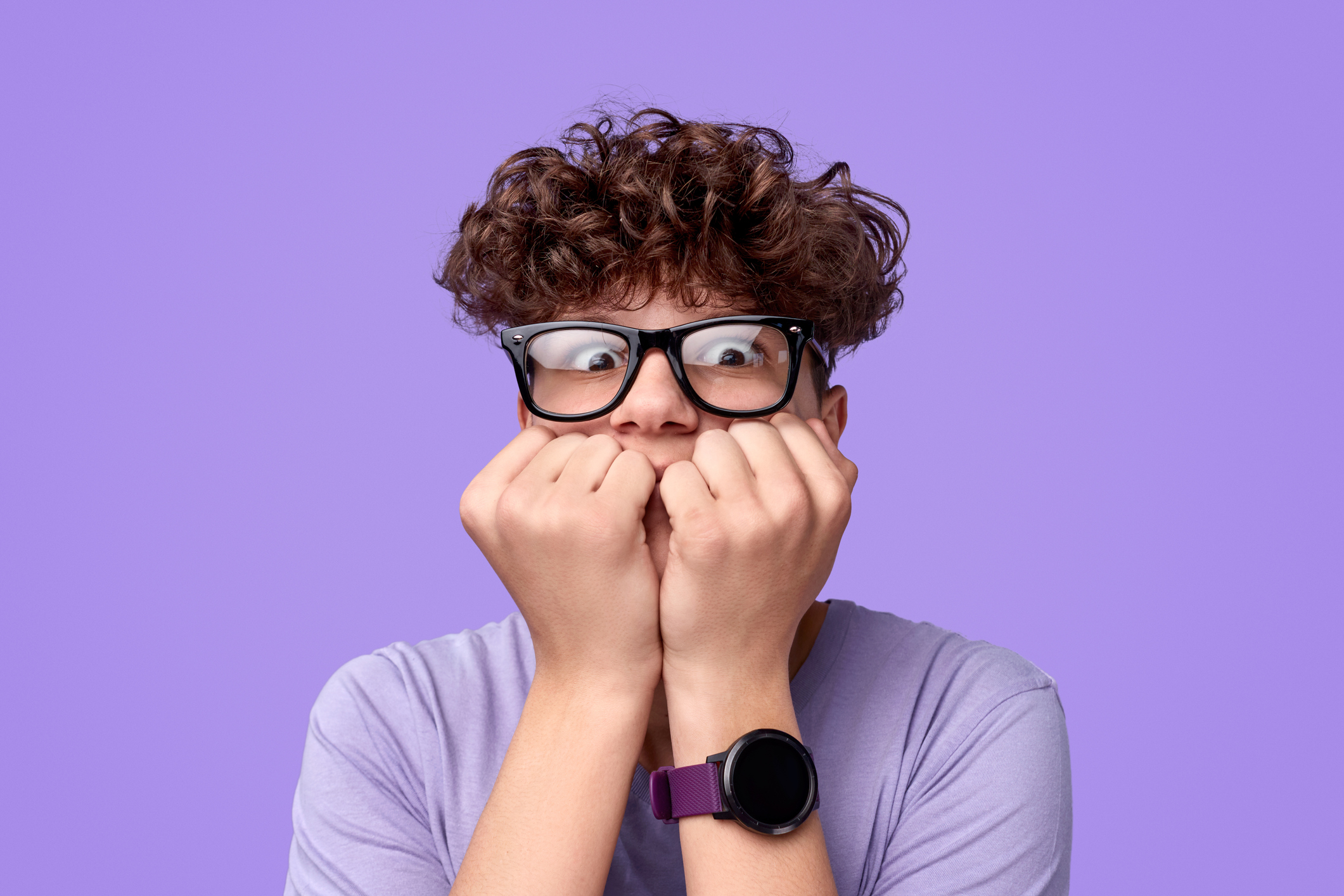 Scared teenager biting nails