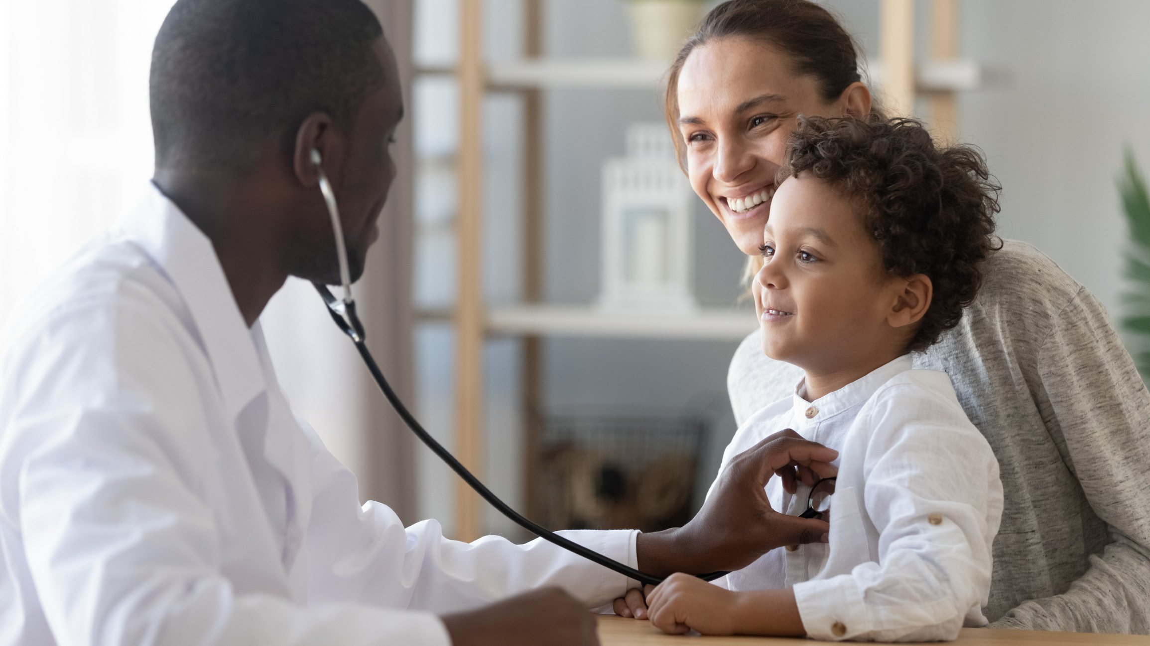 African male pediatrician hold stethoscope exam child boy patient