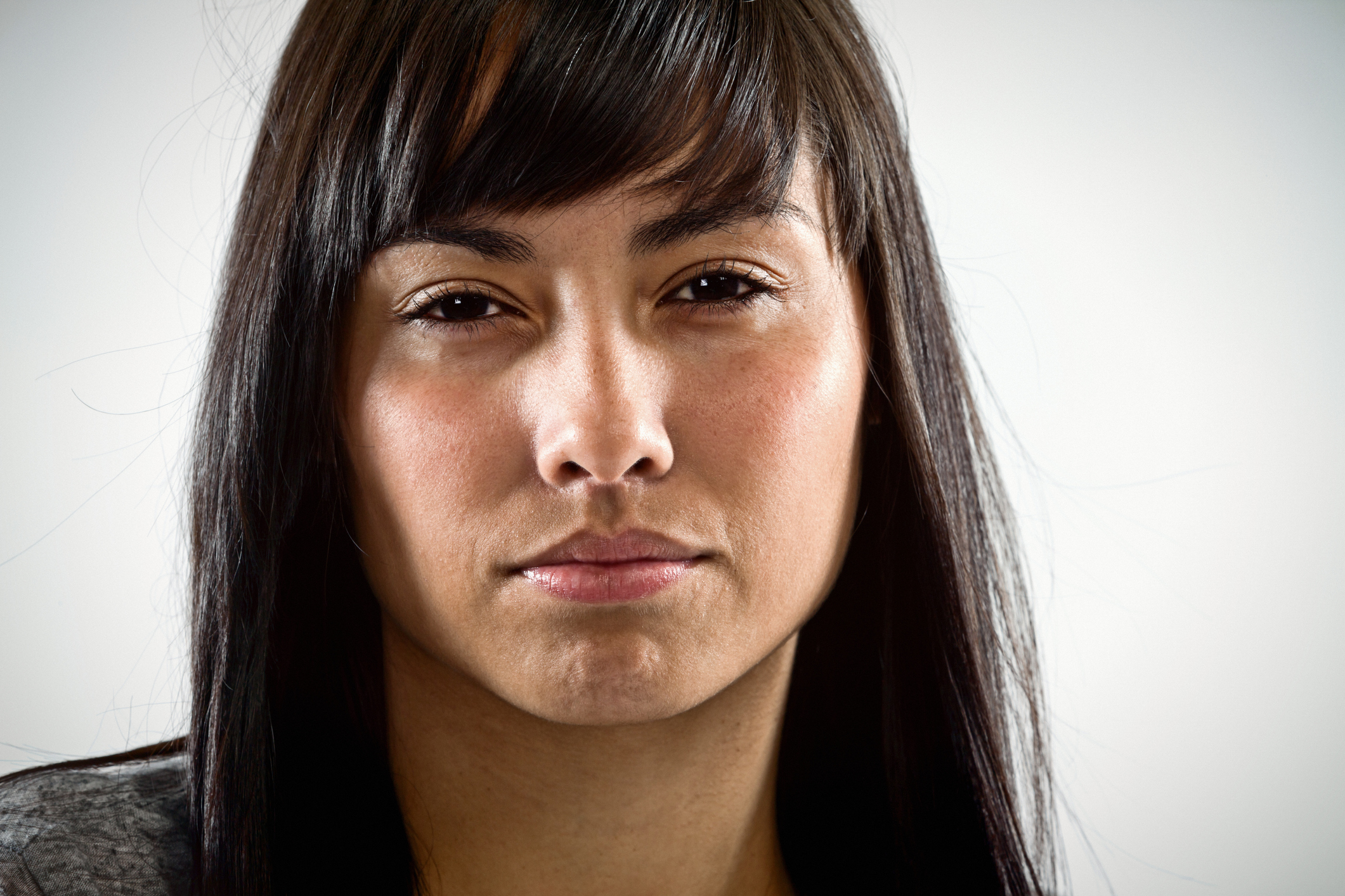 Beautiful brunette stares angrily at camera