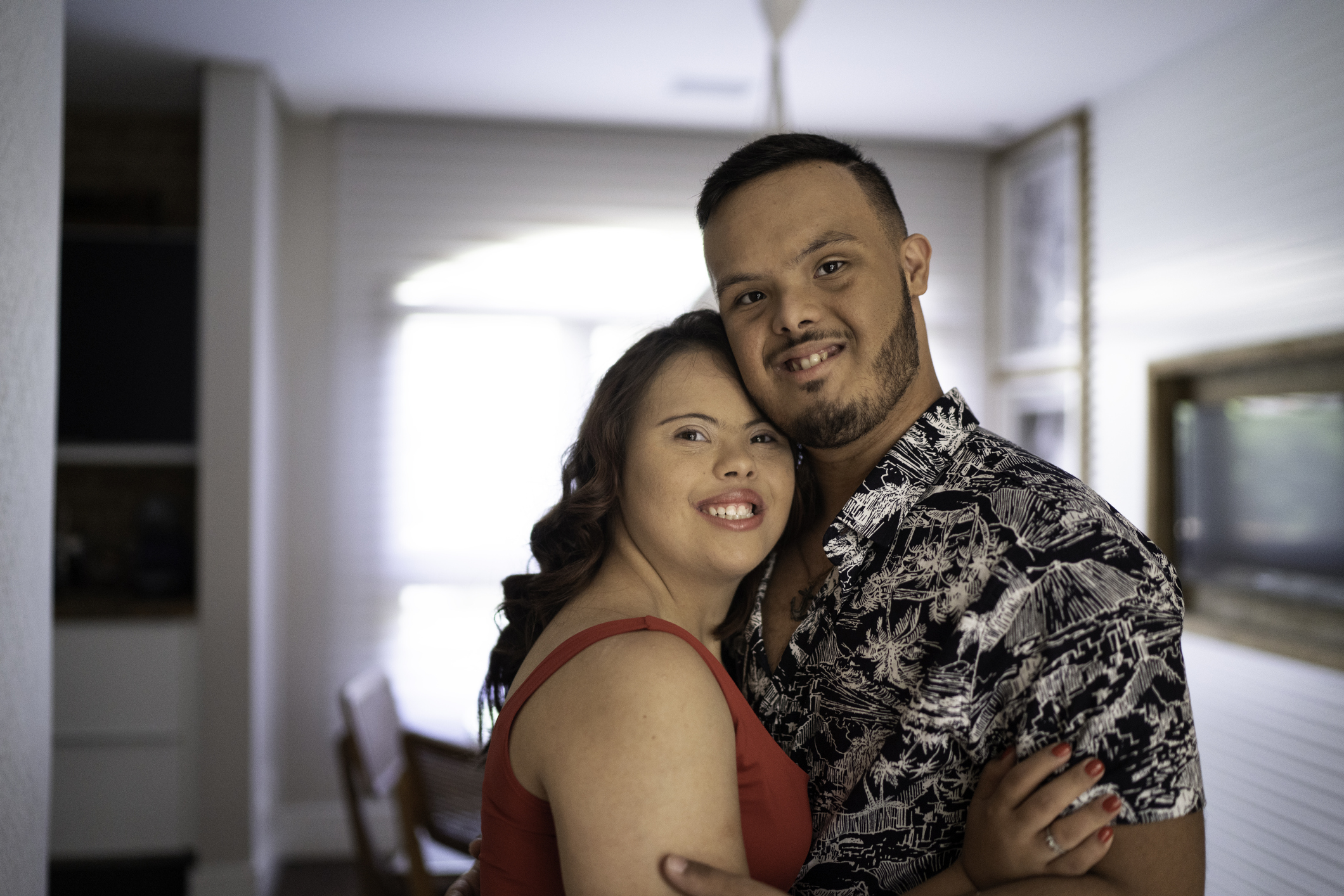 Portrait of happy special needs couple looking at camera