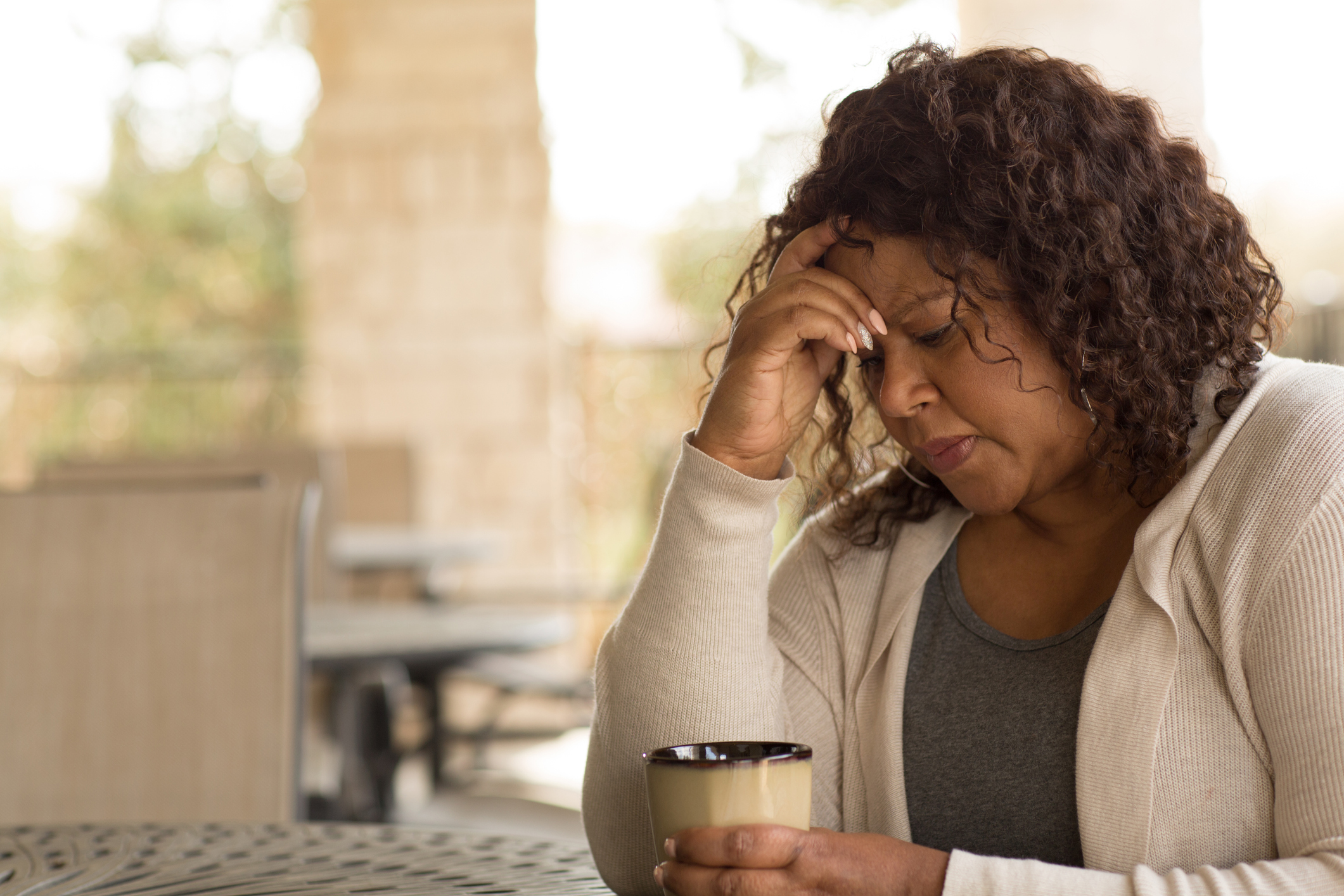 African American middle age woman looking sad.