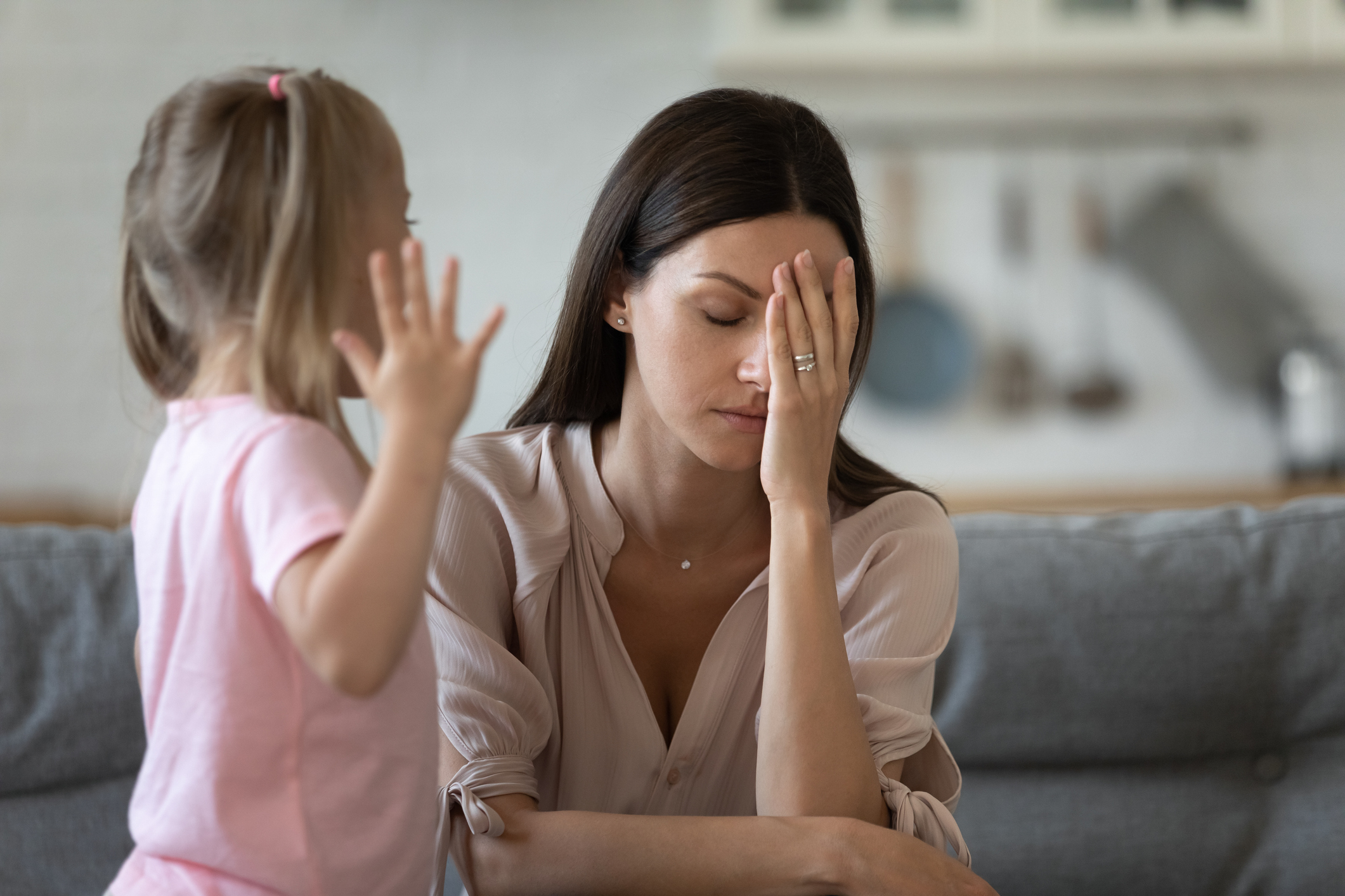 Tired single mother feel desperate about screaming kid daughter