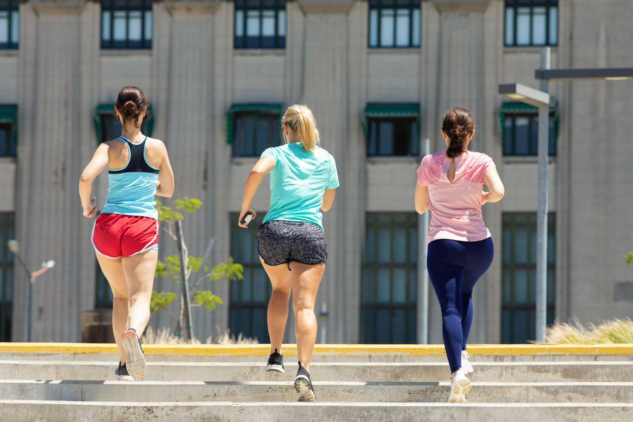 Three active women Stepping up stairways running