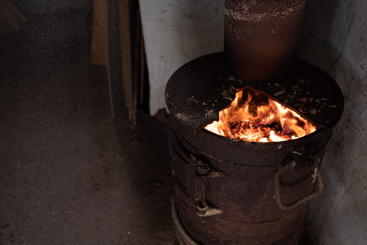 Close up photo of the wood fire potbelly iron stove