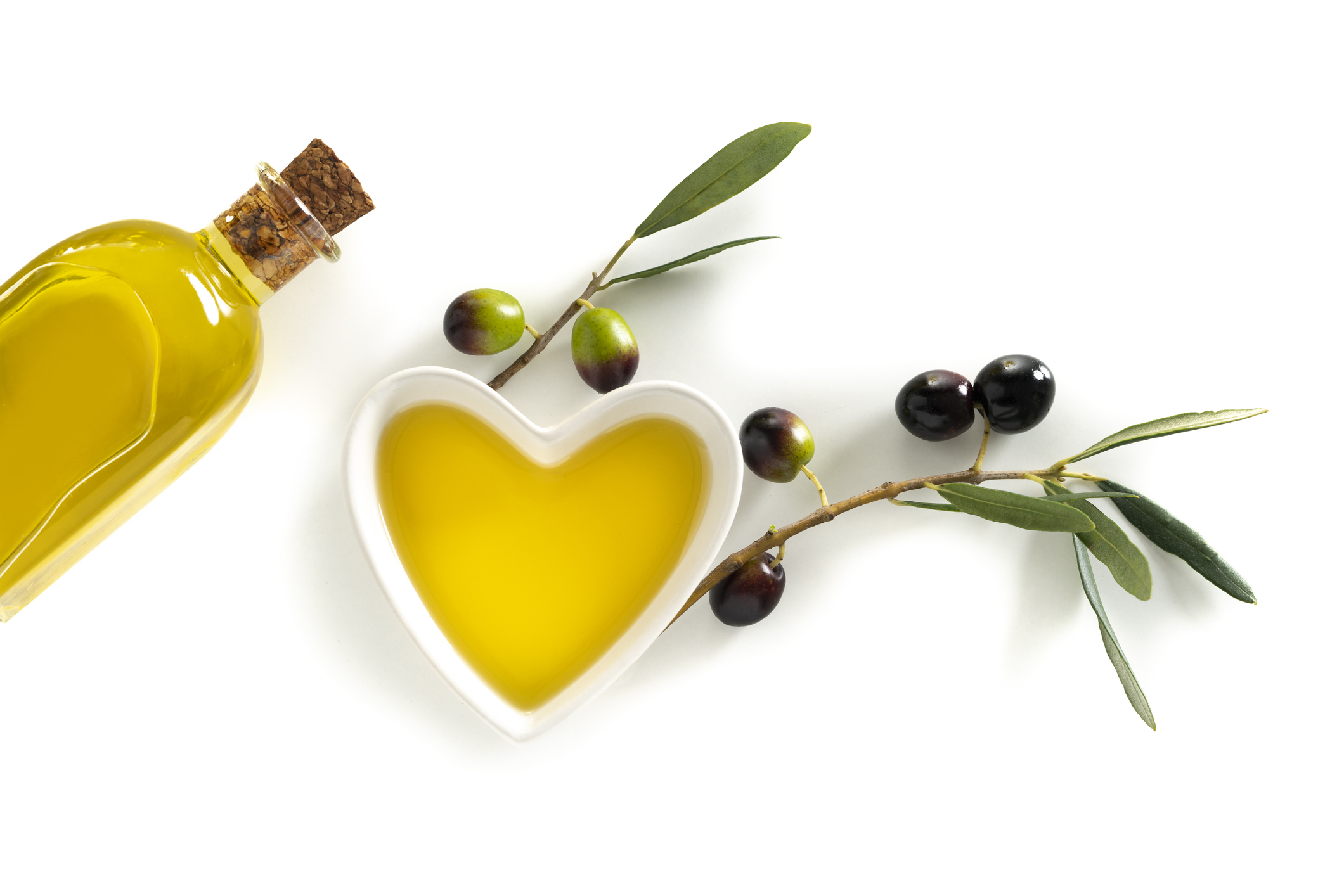 Olive oil heart shape bowl as heart healthy food on white