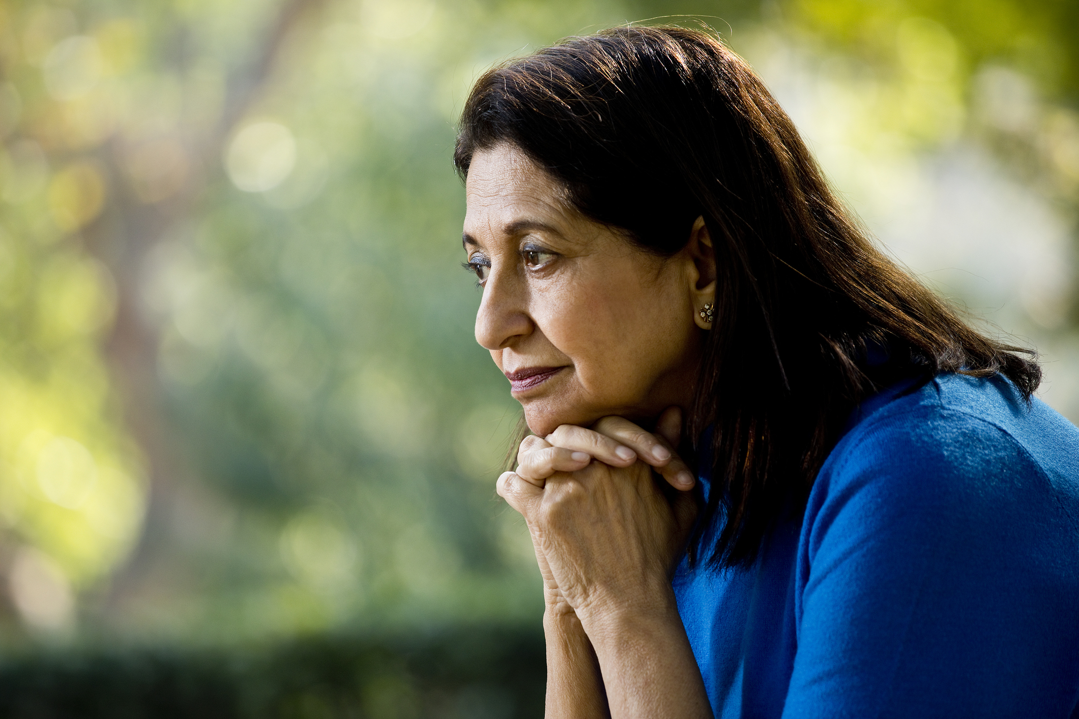 Thoughtful old woman at park