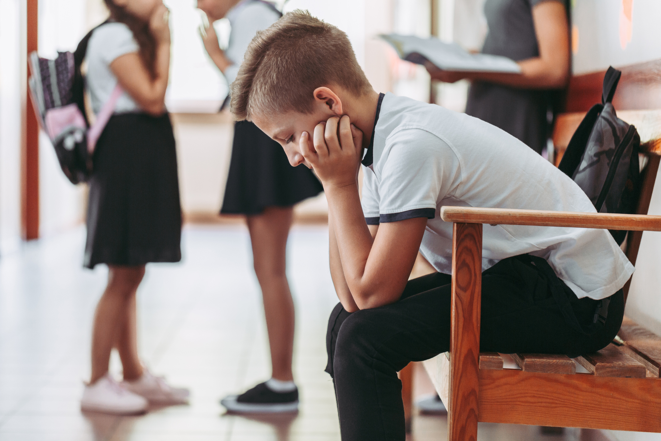 Boy sitting alone