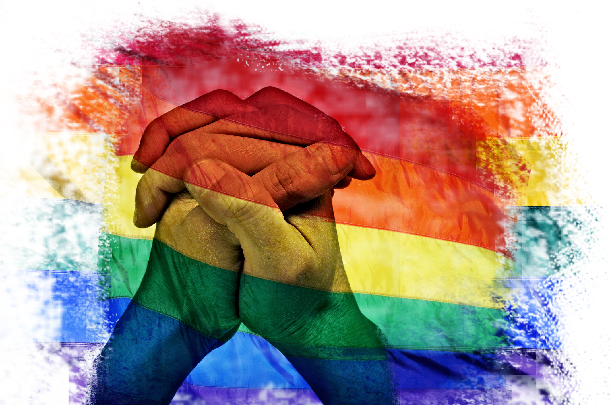 multiple exposures of the rainbow flag and the clasped hands of a man