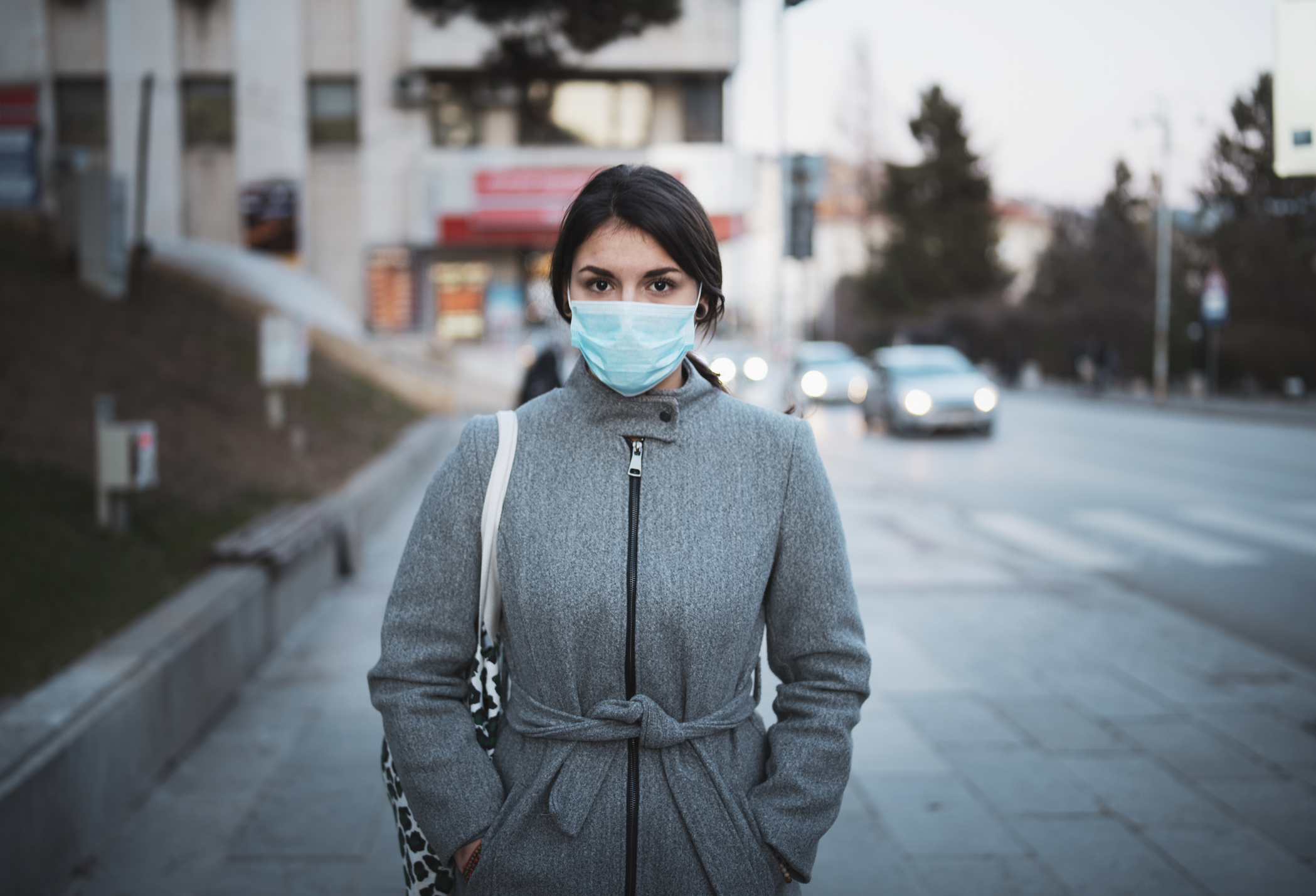 Portrait Of Young Woman With Mask On The Street.