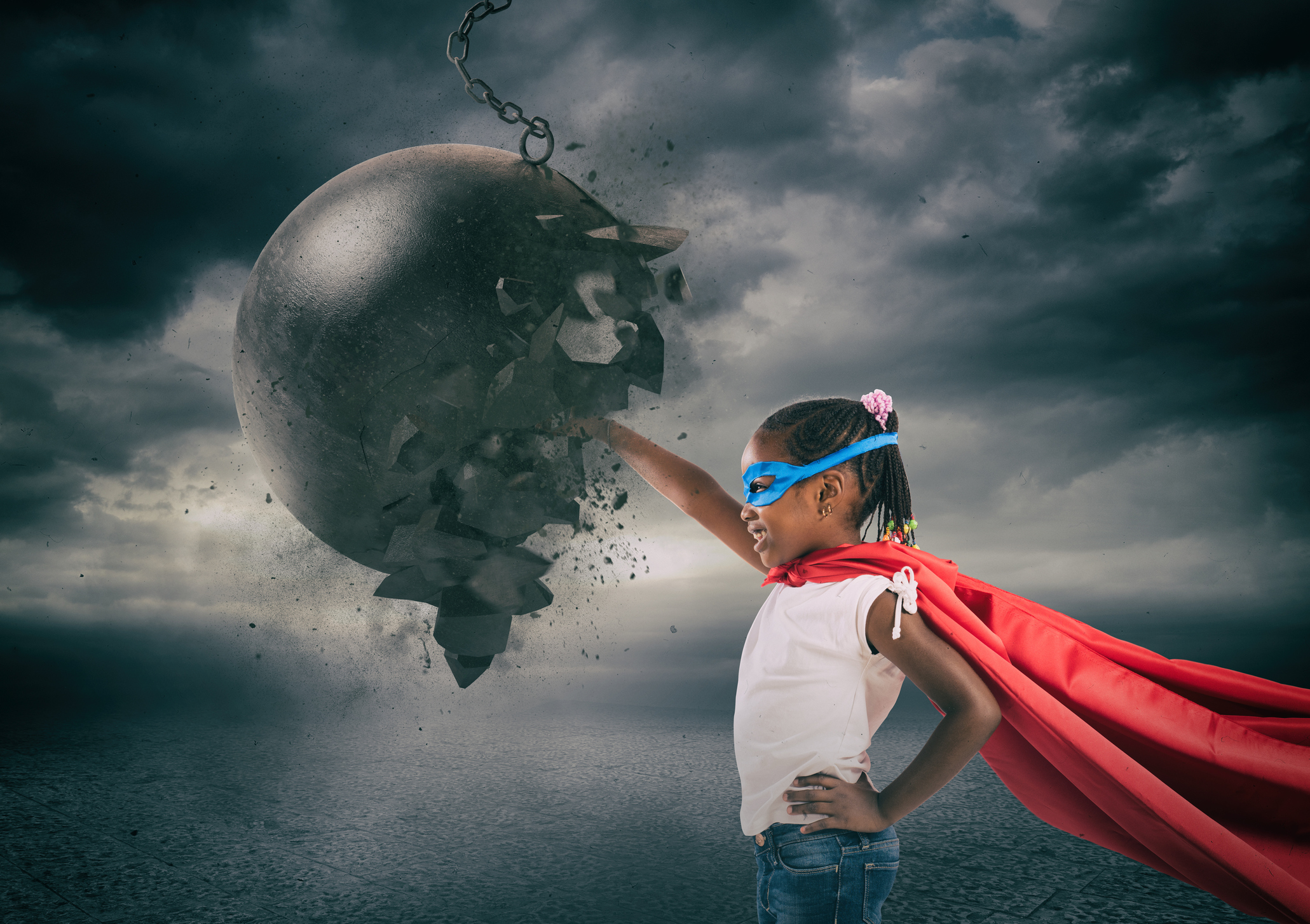 Power and determination of a super hero child against a wrecking ball