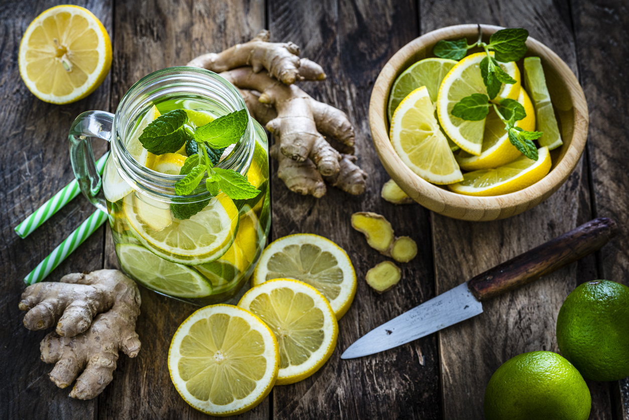 Lemon and ginger infused water on rustic wooden table