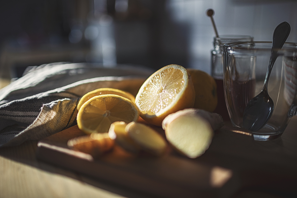 Fresh hot lemon with ginger prepared in a pretty country house kitchen