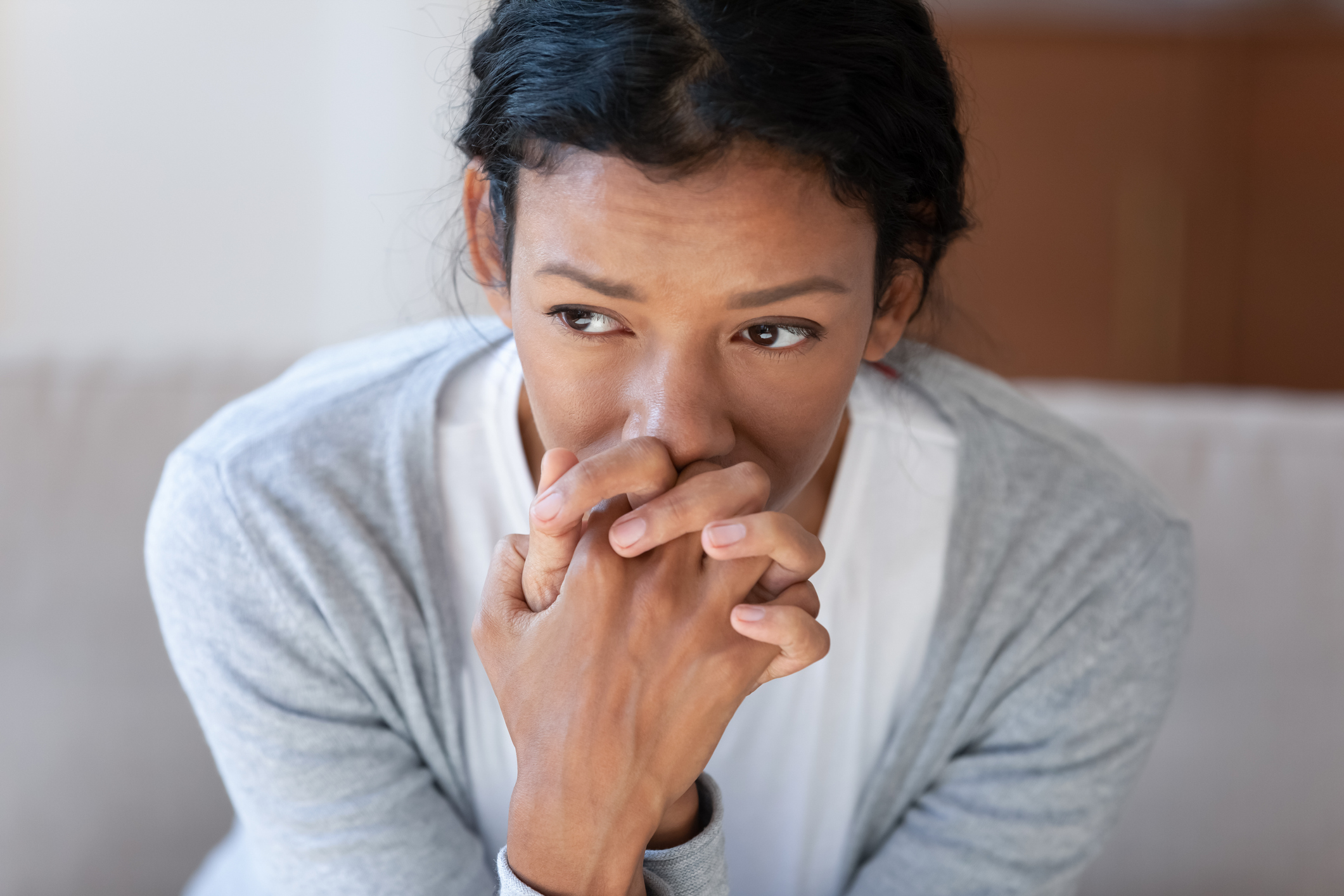 Pensive african American woman look in distance thinking