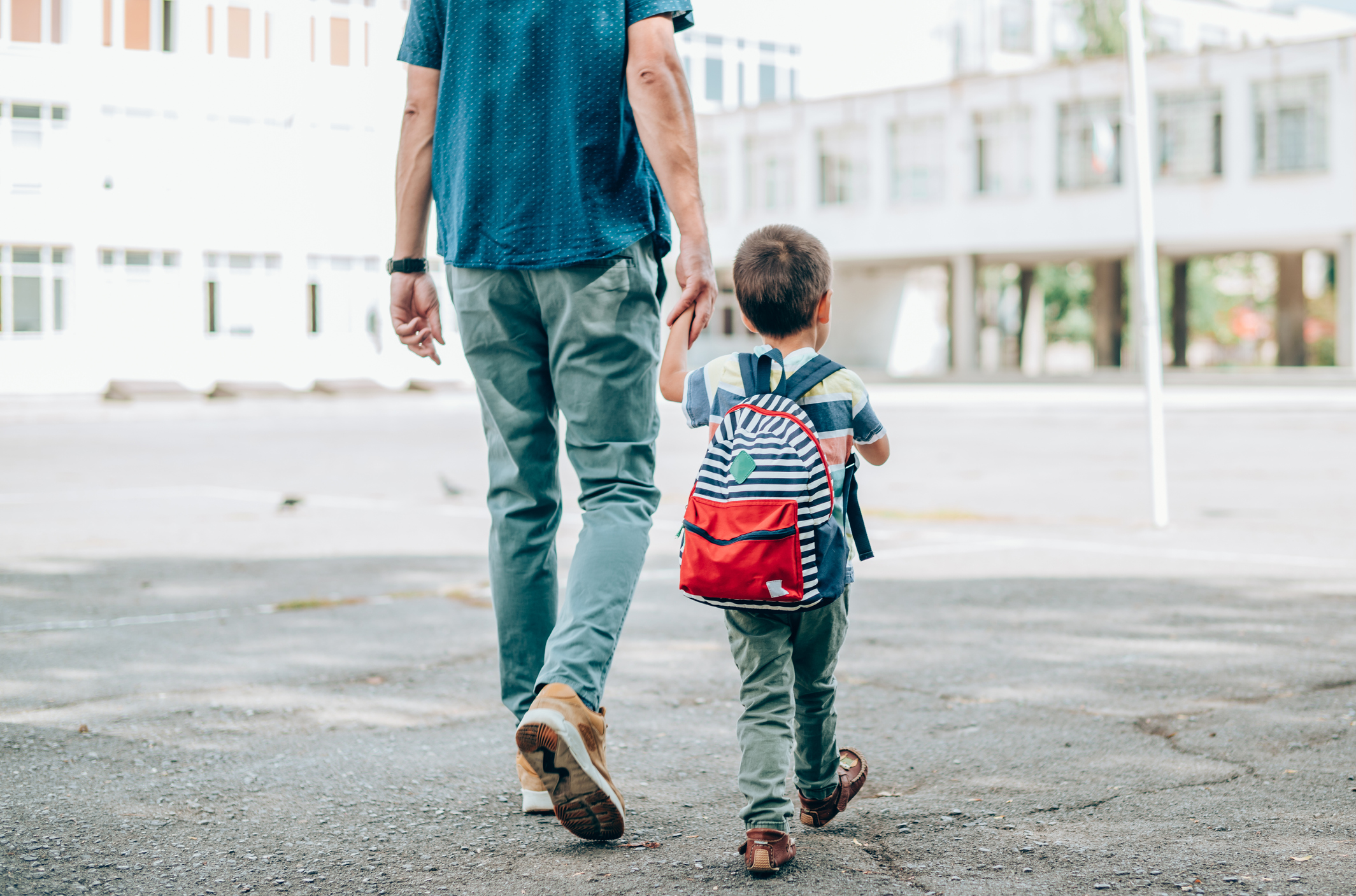 Father and son going to school.