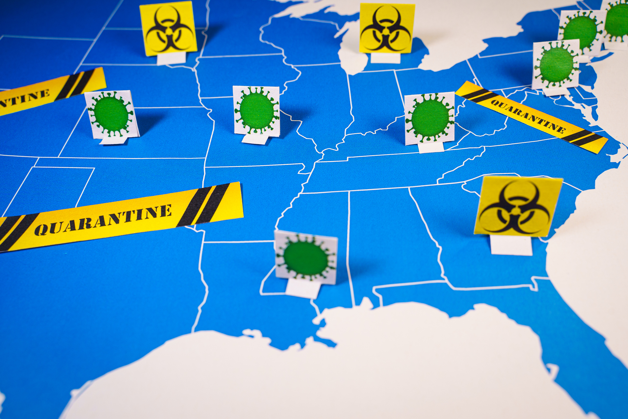 Map of USA with coronavirus and quarantine signs.