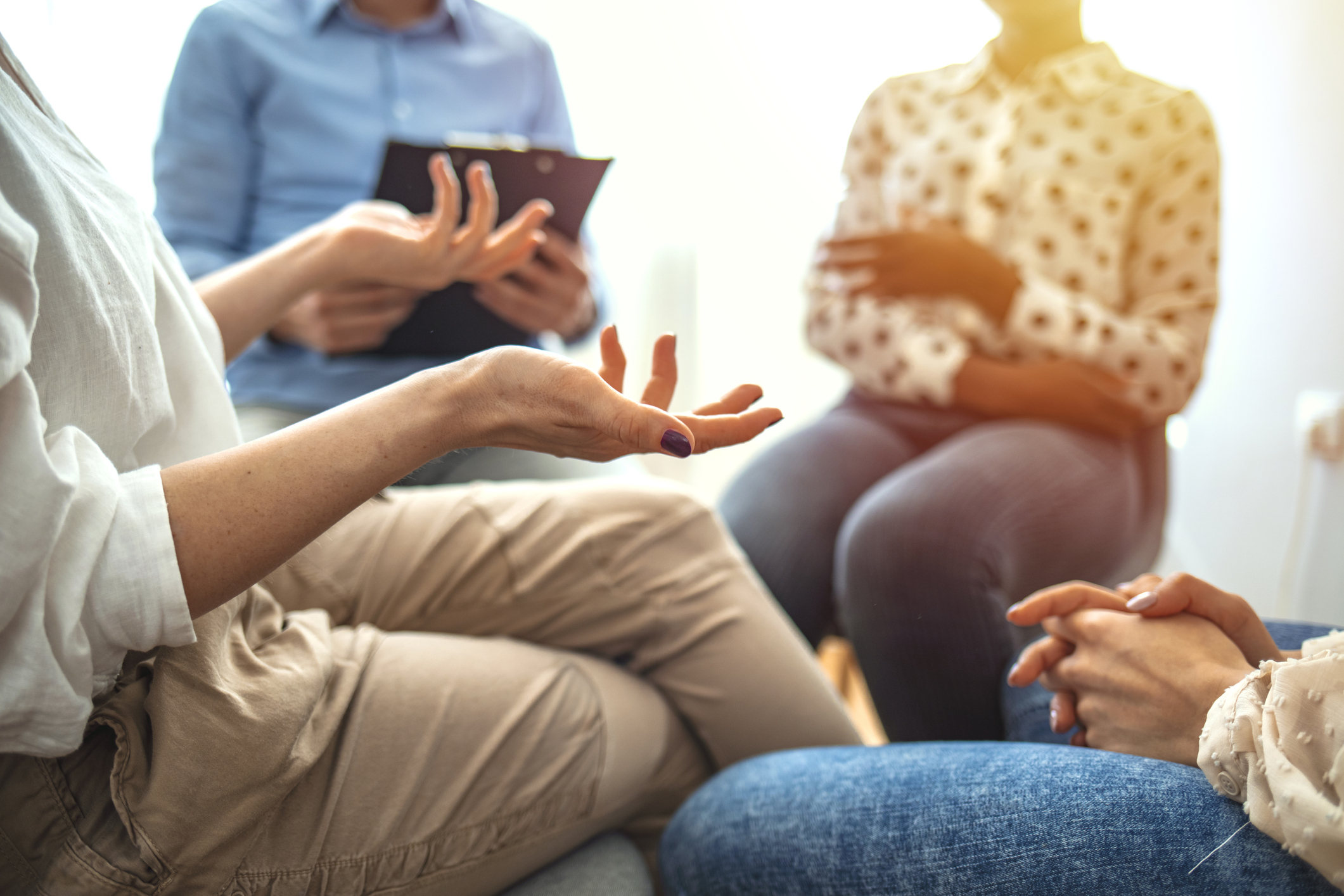 People at group psychotherapy session indoors