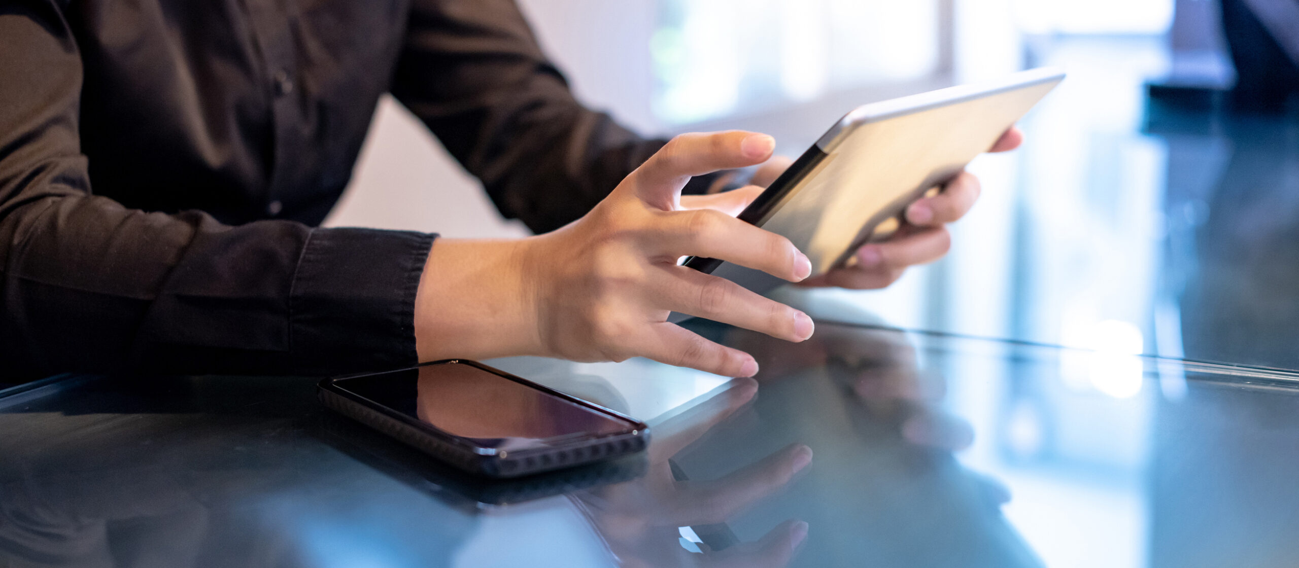 Businessman hand using digital tablet in office