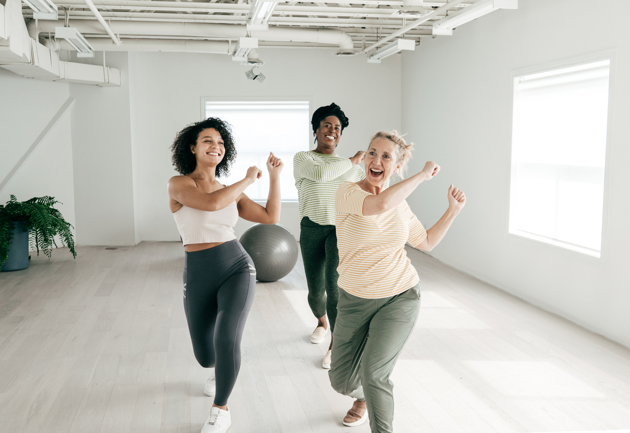 Senior woman attending dance class that recreates the original moves  at a lower-intensity.