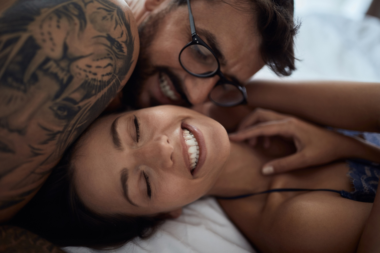 Smiling Man passionately kissing with a beautiful girl