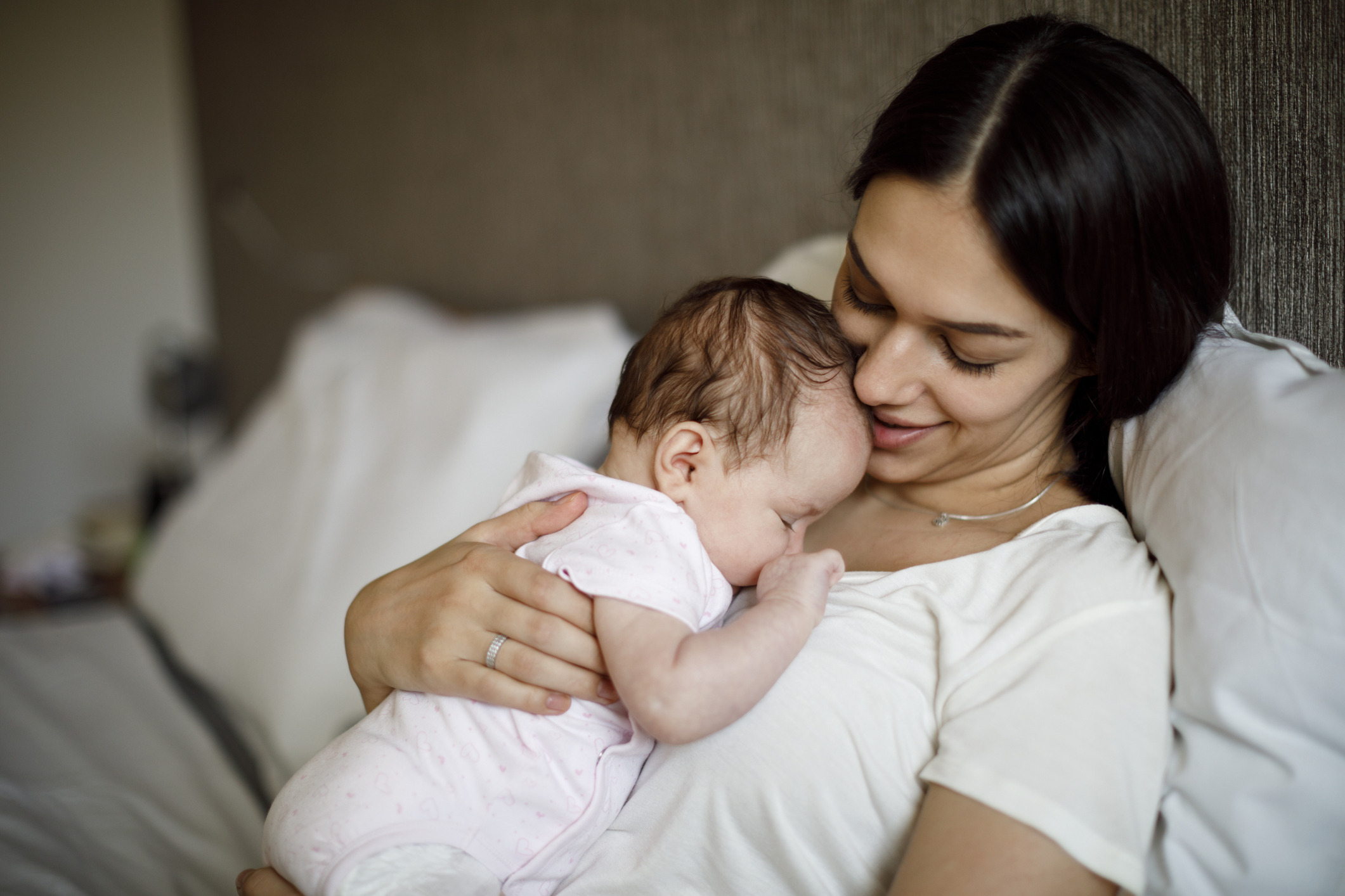 Happy mother and baby at home