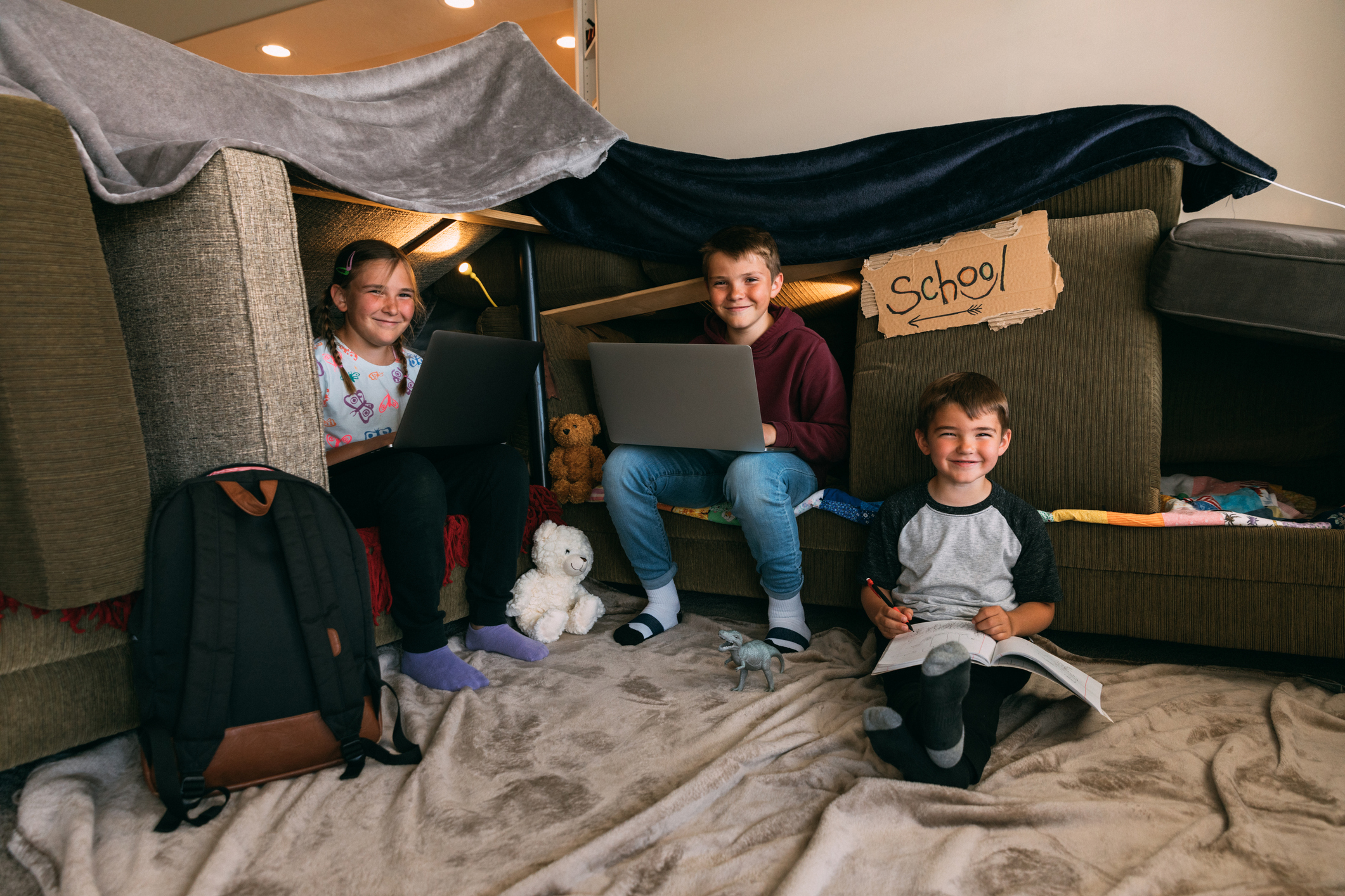 Children Homeschooling in a Couch Fort