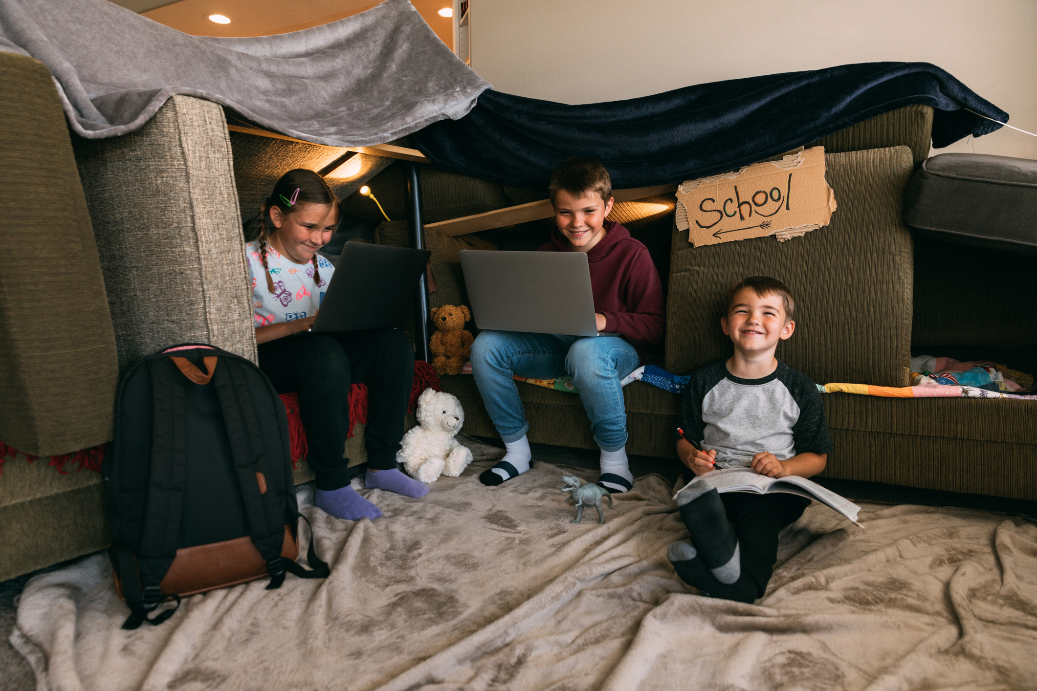 Children Homeschooling in a Couch Fort