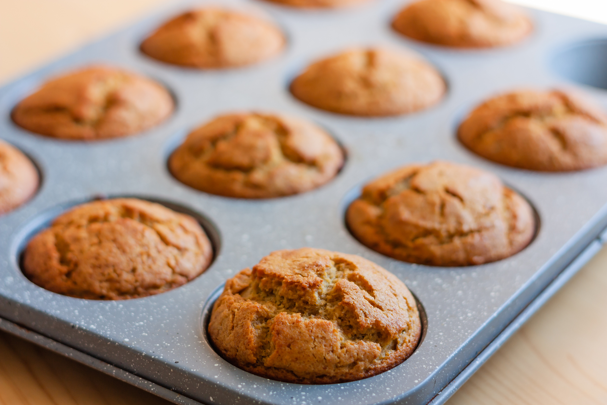 Carrot muffins in metal baking form. Homemade tasty dessert or breakfast. Healthy eating concept.  Selective focus.