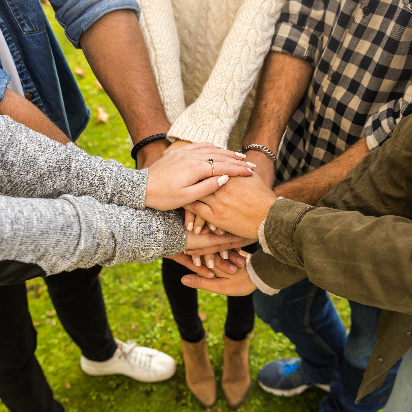 Friends joining hands