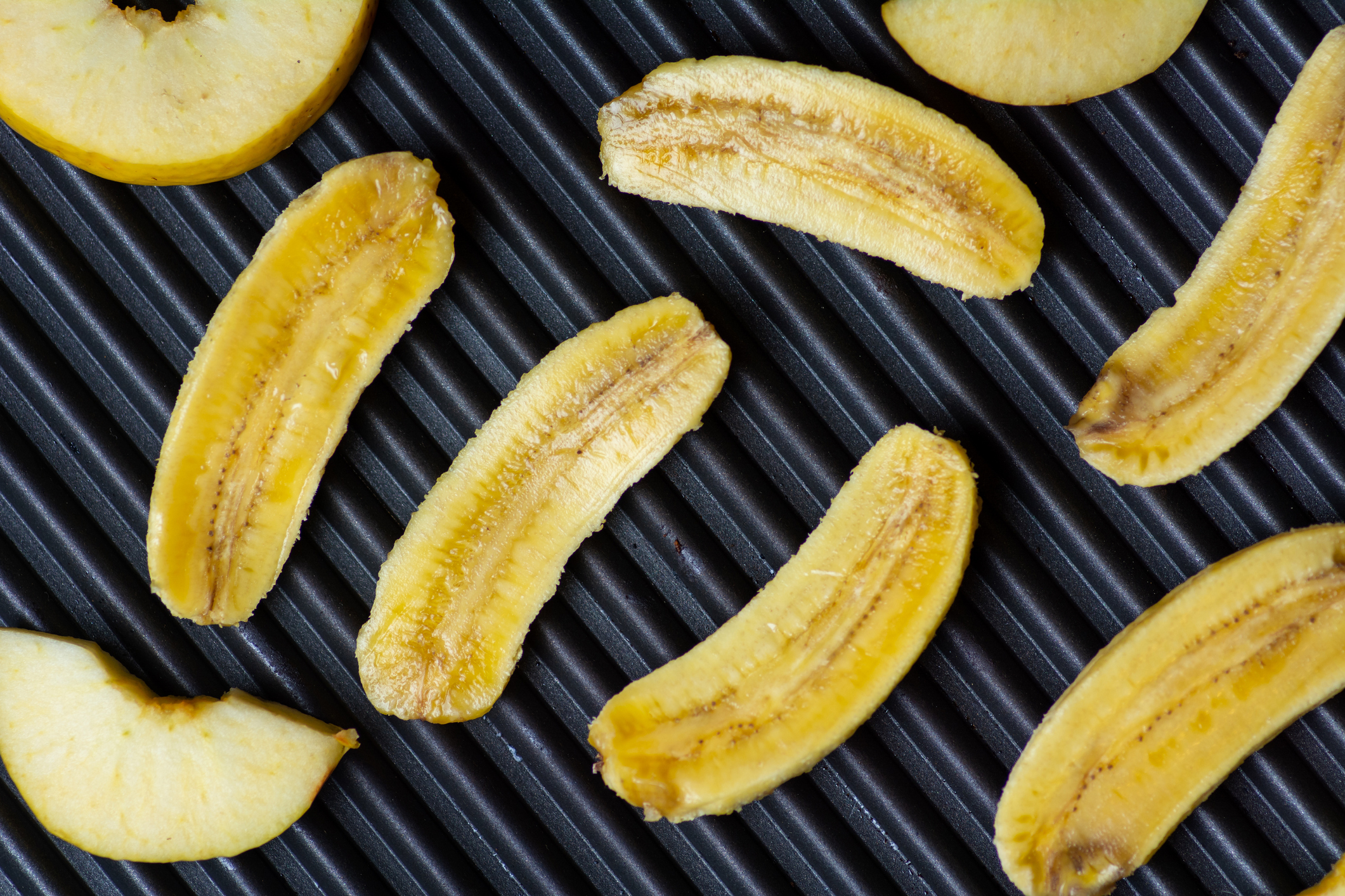 Sliced bananas on the grill