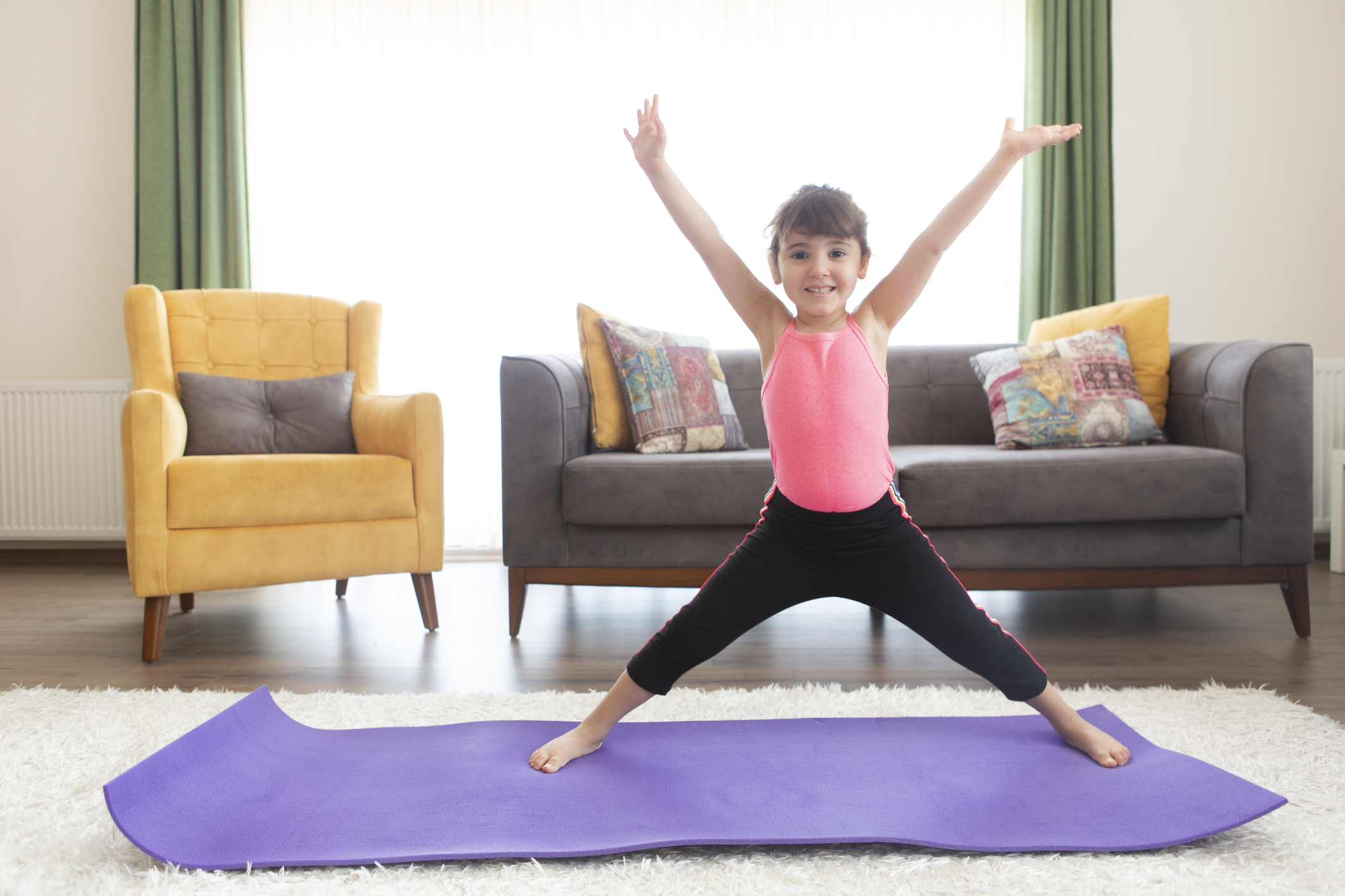 Little Girl Practice Yoga At Home