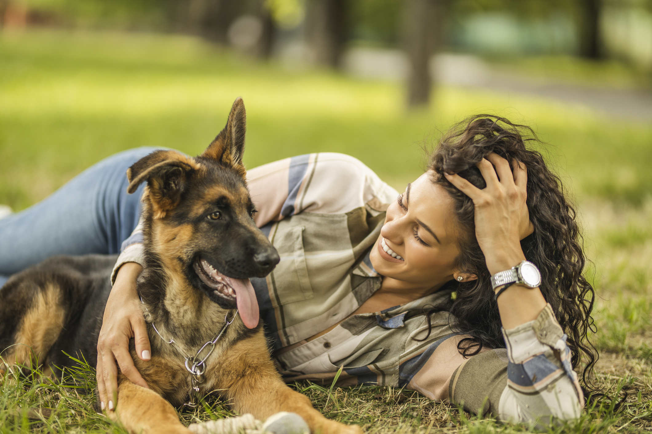 Woman playing with her dog at the park