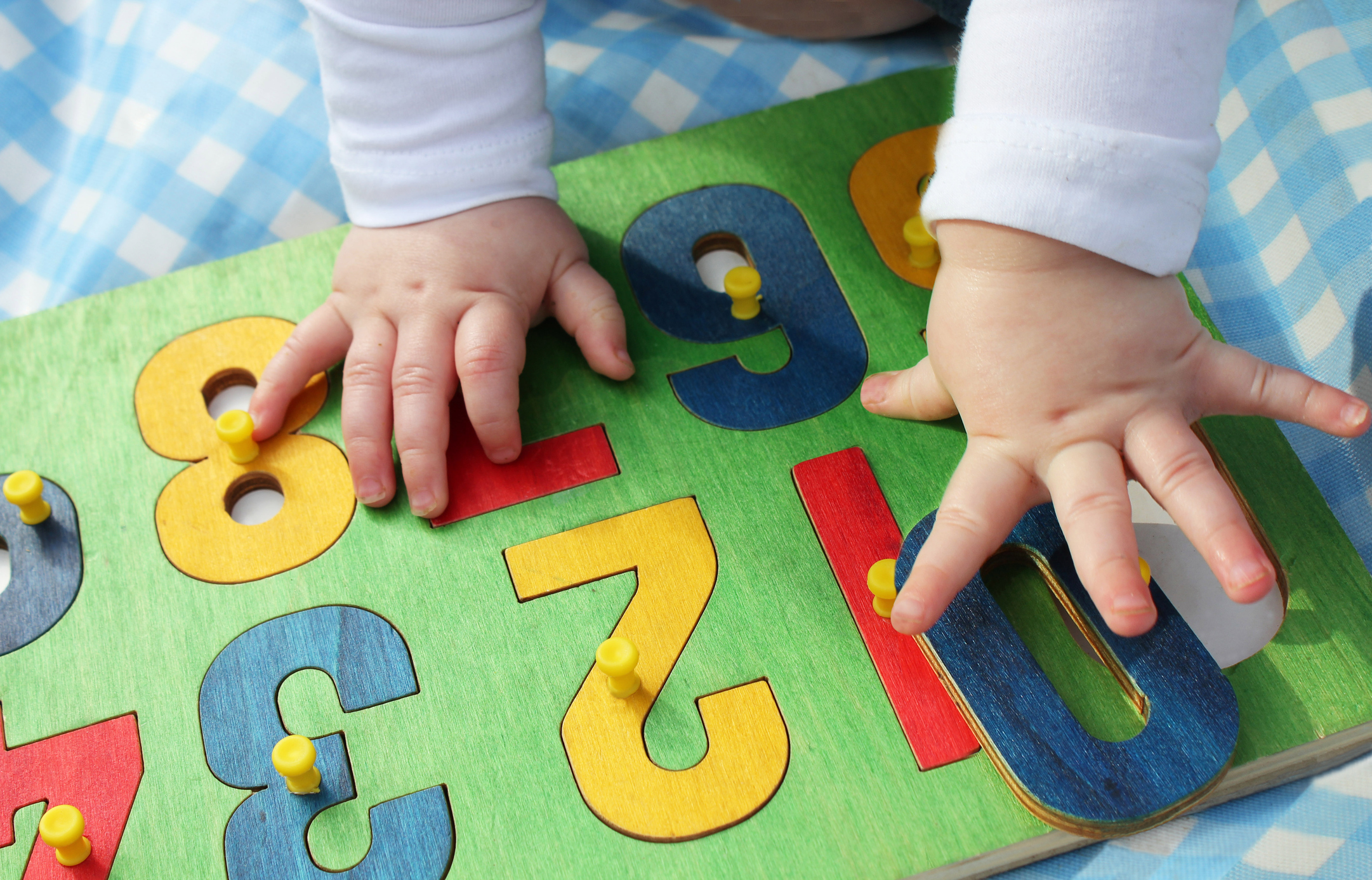 child playing with a number puzzle