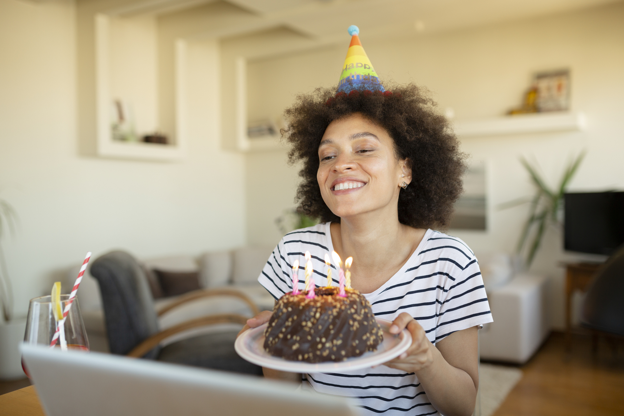 Happy African American woman having a birthday party at home