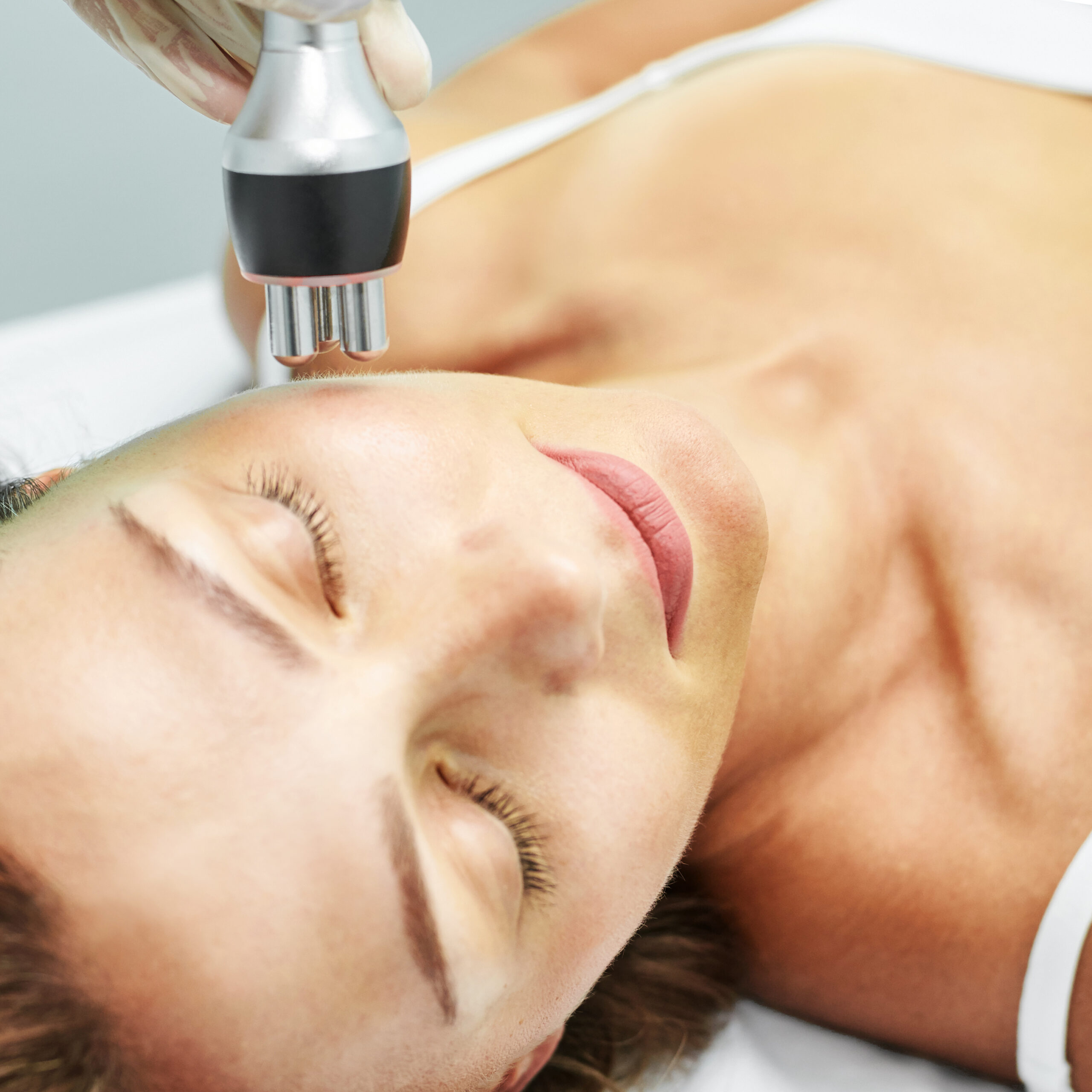 Dermatology skin care facial therapy. Medical spa anto wrinkles procedure. Woman face rejuvenation. Pretty girl. Rf cosmetician equipment